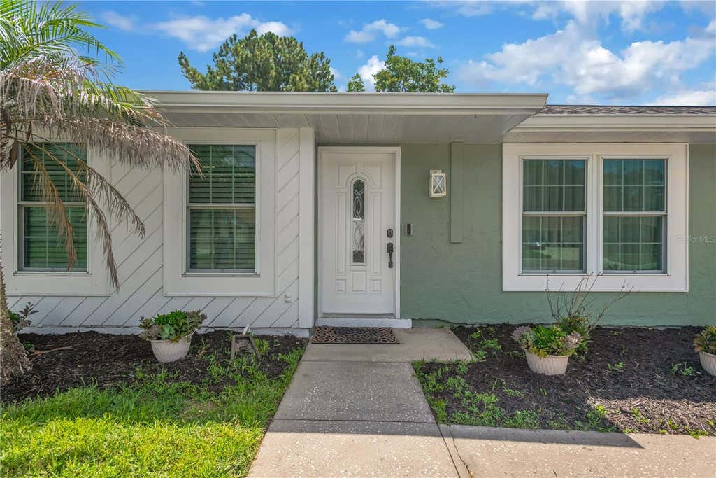 Photo of 819 Jacaranda Drive, Oldsmar, FL 34677 (MLS # TB8539896)