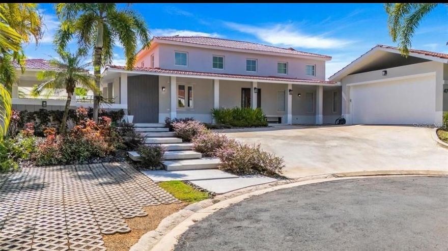 Beautiful Cul de Sac property located in the Sabanera Dorado community. This home was recently fully renovated and has 4-bedrooms, 5.5-bathrooms, high ceilings, mezzanine with office space and additional entertainment areas. Located in a 1,100m² cul-de-sac lot, this home offers ample space, privacy and beautiful garden views. Features include an open layout, high ceilings, new windows, new appliances. new custom kitchen with pantry and family room with built-in TV unit. The spacious master suite has dual walk-in closets and a spacious, fully renovated bathroom. Outdoor living offers a pool, covered terrace, gazebo with bar, Outdoor kitchen, BBQ areas and fenced yard. Equipped with 72 solar panels, 4 Tesla batteries, backup generator, a 600 gallon cistern, solar water heater, whole home water filtration system and water softener. The Sabanera Dorado community offers 24 hr security, miles of walking trails to enjoy the beautiful tropical landscape and a clubhouse with a fitness center, Tennis courts, Basketball courts, pools, La Pergola Restaurant, La Pergola grocery store and access to the best school in the island, The TASIS School in Dorado. Enjoy the best quality of life in Puerto Rico in this beautiful community.