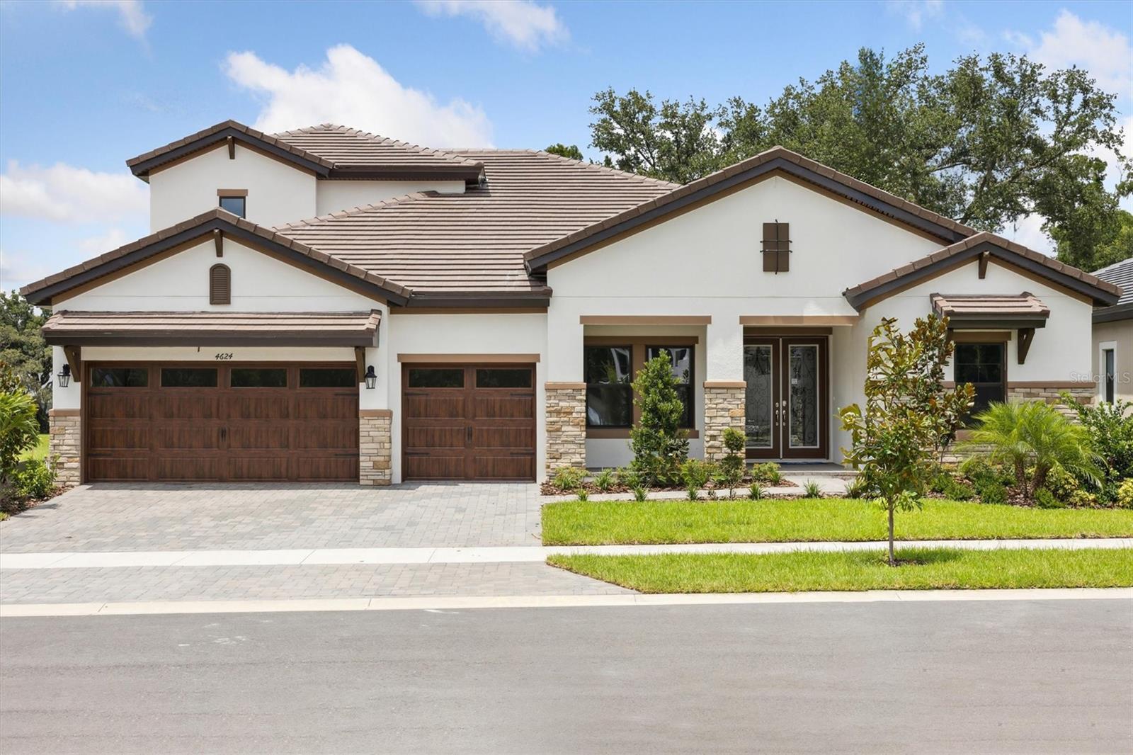 Cedar Key II -
This Cedar Key II is Ready Now! This home features Maddox Painted Harbor cabinets, Frost Whte MSI counter-tops, Home Nutmeg LVP flooring, and more. The Cedar Key II presents a bright and breezy layout that seamlessly transitions from the foyer to the expansive open living spaces! With its impressive 12-foot ceilings in key areas like the foyer, formal dining room, grand room, and gourmet kitchen, it offers a strikingly open atmosphere. The lavish downstairs owner's retreat boasts a double door entry, spacious walk-in closets, and a luxurious owner's bath. This home also features ample secondary bedrooms, a generously sized laundry room, and expansive outdoor living space with a covered lanai and an upstairs bonus room, bedroom and bath. This home also features an upgraded downstairs bonus room as well as an extended bonus room upstairs alongside an extra bedroom. Welcome to Crestwood Estates, a new home community in the established neighborhood of Valrico, FL. Discover a new kind of home building experience where this community will come standard with tile roofs and paver driveways. Listing Price amount for this Pending Sale includes Design and Structural Options.