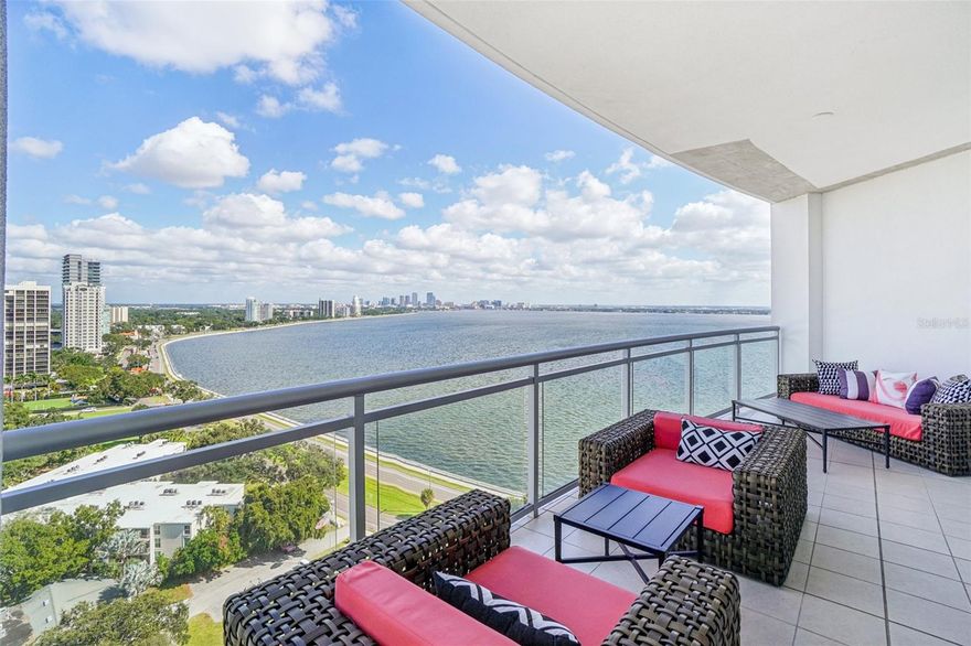 Welcome to this stunning Virage Bayshore residence impeccably designed with bespoke finishes and upgrades giving the feeling of Palm Beach meets NYC vibes. Step off the private elevator directly into your home.  The feature you immediately notice is the abundance of natural light with this corner residence giving you 270 degrees of open, unobscured views of Hillsborough Bay, Downtown Tampa, and the lush green of South Tampa with views all the way to Downtown St Petersburg.  The kitchen features Subzero and Wolfe appliances (gas is available) with upgraded cabinetry, an additional built-out bar area and stunning one-of-a-kind quartzite countertops and backsplash. The kitchen overlooks the dining room and family room which opens to a huge wrap around balcony with ample space for al fresco dining, enjoying the twinkling lights of Downtown Tampa over the shimmering bay, and sunsets 365 days a year!  The large owner’s suite is perfectly angled for the best views and has additional seating space which opens to the oversized balcony.  The master bath has a tub plus a separate shower with beautiful brass fixtures including massaging wall jets. The closet is a dream with gorgeous custom cabinetry with lighting inside and outside of the closets and doors giving the space a nice clean organized look. On the other end of the home are the guest suites, each with a full bath, a den/office, a large laundry room, and conveniently located climate-controlled storage closet.  You must see this gorgeous one-of-a-kind home in the sky to appreciate all the details!