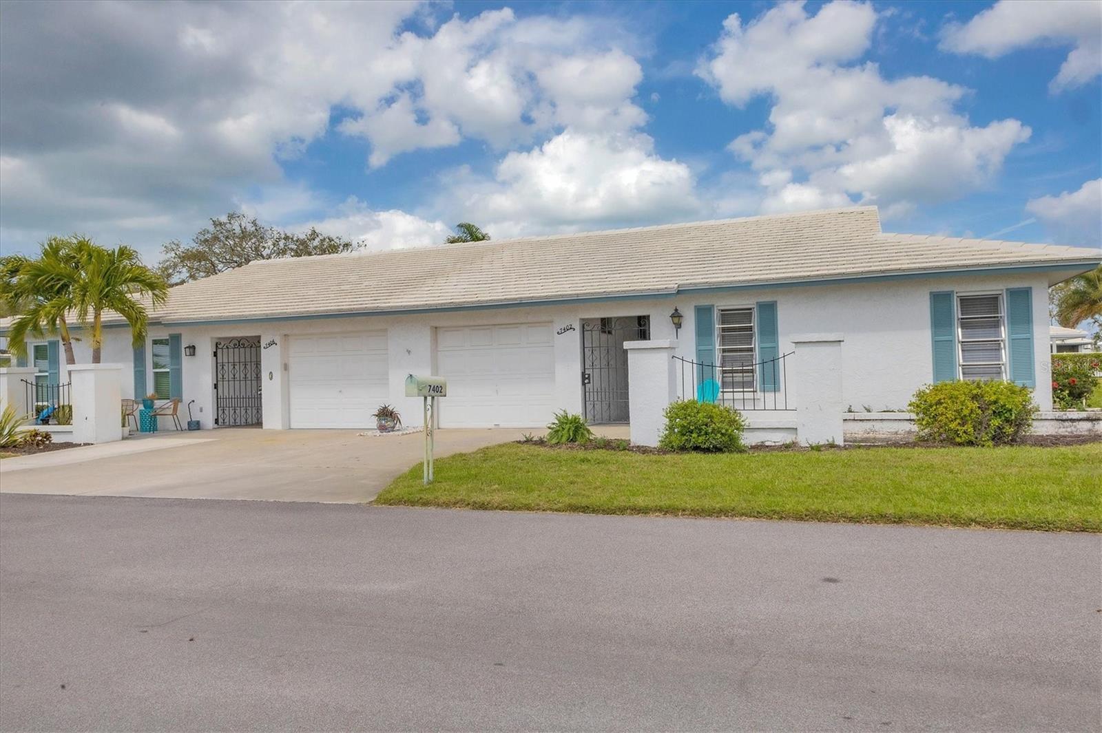 Charming! Tucked in the heart of Village Green, one of Bradenton's most sought-after 55+ communities, this spacious 2-bedroom, 2-bathroom end unit is sure to steal your heart. As you stroll through this inviting condo, you'll appreciate the open layout, beginning with the living and dining room combination that flows seamlessly into the expansive Florida room—an extension of the home with sliding glass pocket doors that allow for effortless indoor-outdoor living.
Open the windows and let the refreshing breeze in as you gaze out onto your large backyard, just steps from the heated community pool. Whether enjoying a quiet morning or relaxing in the evening, the peaceful surroundings make for the perfect backdrop. The separate dinette area is ideal for quaint dinners or sipping coffee while taking in the view through the sliding glass doors.
The kitchen and bathrooms have been beautifully renovated with modern finishes, while still retaining the home’s original charm. Low-maintenance flooring throughout makes for easy upkeep. The quiet street ends in a cul-de-sac, ensuring no busy cut-through traffic and creating a serene environment.
With ample storage space, this condo is move-in ready—simply pack up your house and make Village Green your new home. Located just a short distance from the stunning beaches of Anna Maria Island, this property offers the perfect balance of peaceful retreat and convenience to everything you need.