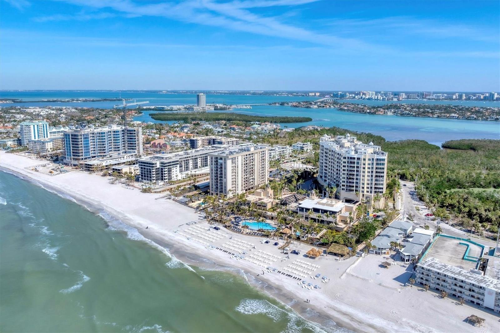 Luxury Beachfront Living at The Ritz-Carlton Beach Residences awaits. Experience the epitome of luxury and coastal living in this stunning residence at the one and only Beach Residences at the Ritz-Carlton and YES, you can purchase the Gold Membership at closing and immediately enjoy the benefits of FULL Beach, Spa & Fitness Access AND Limited Golf, not to mention the sensation restuarants! This Gold Club Membership is only able to be purchased with this unit at closing! The Ritz-Carlton Beach Residences are located along Sarasota’s renowned Lido Key. This exquisite 3rd-floor condo offers unobstructed, panoramic views of the Gulf, pristine sandy beaches, and vibrant sunsets that transform the sky into a breathtaking canvas.The renowned Ritz Beach Residences stand 12 stories high with 88 total units in the building. Boasting over 2,000 square feet of meticulously designed living space, this stunning residence features 2 bedrooms, 2 bathrooms, and an open-concept floor plan perfect for both relaxation and entertaining. Every detail has been thoughtfully curated, from the chef-inspired kitchen with high-end appliances to the expansive living and dining areas that flow seamlessly into a private terrace for alfresco dining under the stars. The outdoor covered space consists of 431 square feet of wrap around terrace. The owner's suite is a true retreat with its luxurious spa-like bath, large walk-in closet with custom built-ins, and direct access to the terrace. Every room offers refined finishes and superior craftsmanship, with custom cabinetry, marble and granite countertops, and designer flooring throughout. As a resident of The Ritz-Carlton Beach Residences, you’ll have exclusive access to world-class amenities. This unit is located on the amenity level so open your front door and let the relaxation and enjoyment begin. Amenities at your disposal include a heated pool, spa, gas grills for cooking, state of the art gym, massage rooms, two guest suites for your overnight guests to enjoy, a private movie room, community room for all residences, board room, and more! Enjoy an assigned parking space conveniently located on the first floor of the garage. The legendary Ritz Carlton service offers concierge services, 24-hour security, 365 days a year. Whether you’re seeking a serene escape or a vibrant, social atmosphere, this property offers it all. Located just moments from St. Armands Circle, downtown Sarasota, renowned shopping, dining, and cultural attractions, this is an opportunity to live in one of the most coveted beachfront properties on the Gulf coastline. Don't wait to book your private tour of this incredible home and start enjoying the sensational lifestyle that the Ritz-Carlton is known for. Unit 304 is waiting for you! CALL NOW FOR YOUR PRIVATE TOUR BEFORE IT'S GONE. Furniture is available for purchase!