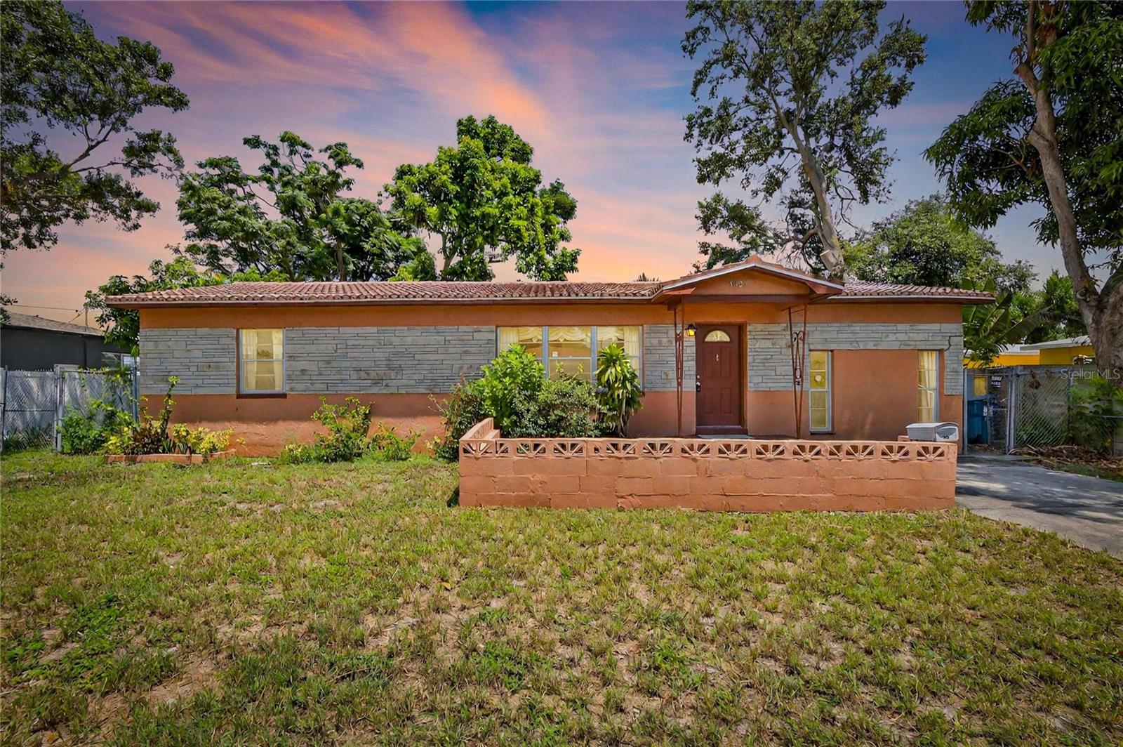 With a little vision and elbow grease, this mid-century concrete block home can be transformed into your perfect Florida retreat. This 2-bedroom, 1-bathroom residence also offers a living room, a family room and a versatile flex/bonus room just off the dining area, ideal for a home office, game room or hobby space. While the home retains its vintage charm, it will require updates and repairs, making it an excellent opportunity for those looking to renovate and build equity. Situated on an 8,455 sq. ft. lot, the backyard boasts mature, producing mango, avocado, and papaya trees—your own tropical harvest just steps from the door! Located just minutes from downtown St. Pete, the St. Pete Pier, and some of Florida’s best beaches, this property offers both potential and location for the buyer ready to make it their own. Best of all, there’s no HOA or CDD, giving you the freedom to make it truly yours. Schedule your appointment today!