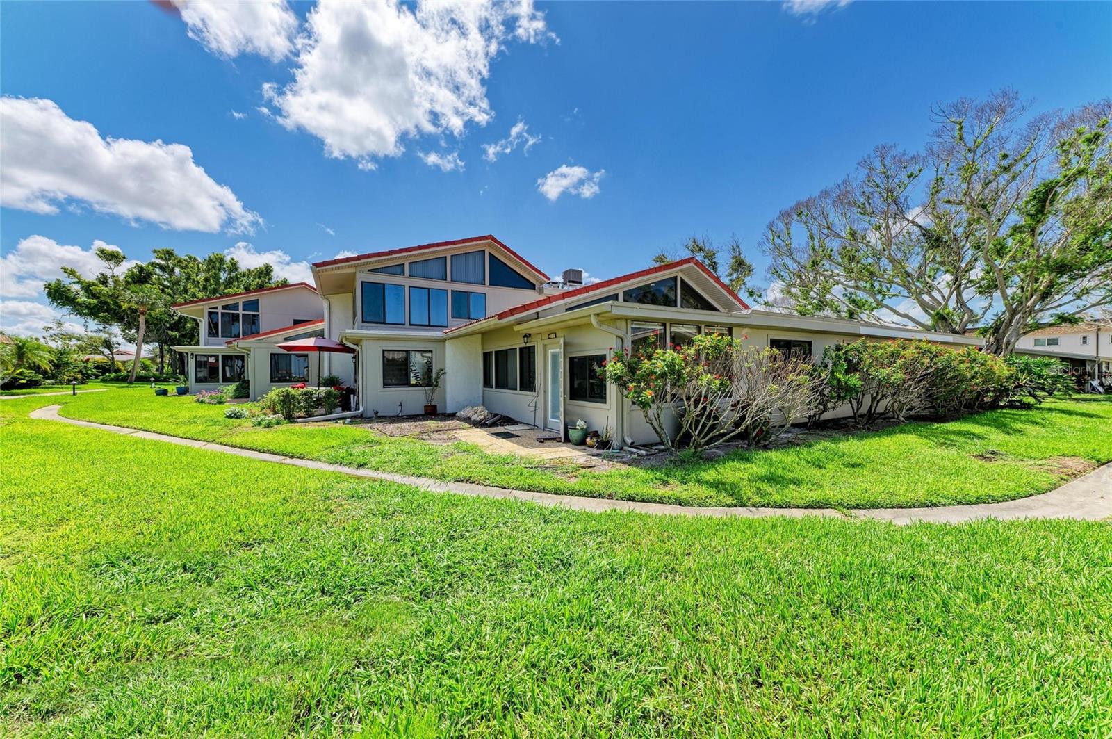 Attention Investors! Discover the incredible potential of Aldea Mar, The Village by the Sea, a stunning condominium complex right on the Gulf offering exclusive access to a breathtaking beach and warm gulf waters. Here’s your chance to transform a 2-bedroom, 2-bathroom fixer-upper, end-unit villa, perfectly positioned in the lush, tree-lined heart of the complex, surrounded by vibrant Florida greenery and just steps away from the inviting community pool. This spacious unit is filled with natural light, boasting hurricane-impact windows and elegant vaulted ceilings with a warm wood finish in the great room. Just released back to the owner after the association completed remediation from last year's storm, the essentials are now in place - electrical systems are operational, the HVAC system is active, a new water heater has been installed, and new walls have been put up by the association. Priced attractively in unfinished form, what’s left is an exciting opportunity to customize the bathrooms, flooring, trim, and kitchen to your liking. Aldea Mar allows for monthly rentals up to four times a year making it ideal for investors seeking flexibility, or for those who wish to share time between rentals and personal use. For pet owners, the association welcomes one small pet up to 30 lbs. Don't miss your chance to enter this wonderful beach front community at an unbeatable price. You have the opportunity to make this unit truly yours, reflecting your personal style and vision! Enjoy a resort-like lifestyle with community amenities that include a large heated swimming pool just steps from the beach, a putting green, shuffleboard, and a vibrant clubhouse. Plus, you’ll be only one mile away from quaint downtown Venice Island, filled with gourmet restaurants, a weekend farmer's market, and charming art shops and unique boutiques. Call today to arrange your private showing and take the first step toward realizing your dream beach investment!