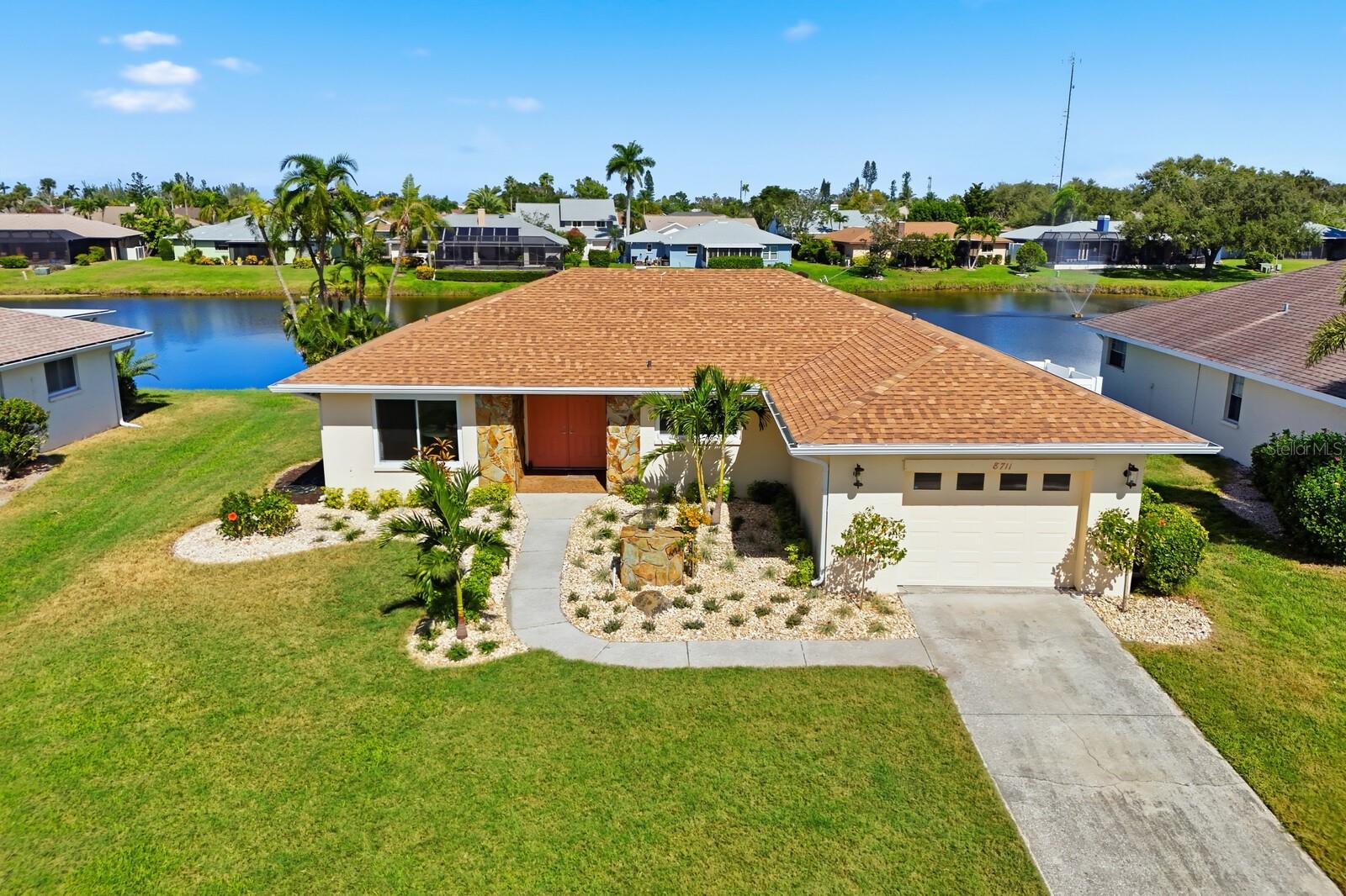 This beautifully updated two-bedroom, two-bathroom home is located in the desirable Bay Lake Estates neighborhood—just five minutes from Anna Maria Island and Florida’s stunning Gulf beaches.
The home has been completely renovated inside and out, featuring a brand-new roof and fresh exterior paint. Inside, you’ll find brand-new wood-plank porcelain tile flooring throughout, new baseboards, re-textured and painted ceilings, and freshly painted walls.
The kitchen has been fully remodeled with all-new soft-close cabinets and drawers, quartz countertops, stainless steel appliances, and a floating island with a stainless steel top. Both bathrooms have been completely updated with new valves, toilets, shower tile, and vanities. Each closet in the home includes custom modular shelving for optimal organization.
Natural light fills every room, highlighting breathtaking views of the lake out back—home to a variety of local wildlife, including bald eagles, ospreys, ibises, rails, limpkins, herons, egrets, ducks, geese, turtles, and even juvenile sharks and tarpon. Enjoy these views from the brand-new screened-in porch, the perfect place to relax and take in the tranquil surroundings.
Additional upgrades include fresh blown-in R-19 insulation, a complete A/C system clean-out for peak performance, new soffits and fascia, a whole-house gutter system, fresh landscaping, and more.
Bay Lake Estates offers convenient, maintenance-free living with community dues covering lawn care and irrigation, for the low monthly fee of $196. This move-in-ready home combines modern updates, serene water views, and proximity to Anna Maria Island’s best beaches, restaurants, shopping, and activities.