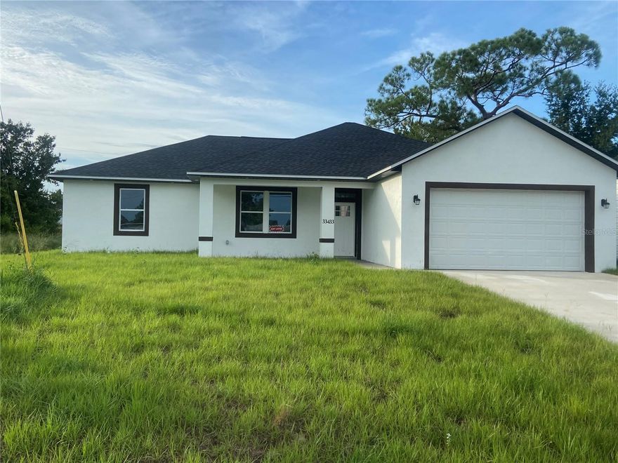 New Construction in the heart of Sebring in the desirable area of Sebring Country Estates at only $178 per sq ft. Buyer Incentive of $5000.00. Spacious open, split floor plan, 3/2/2 block home. Open concept with great room featuring a 10 foot high  tray ceiling, recessed LED lighting & prewired for ceiling fan. All other ceiling are 9 ft high. Home features,  porcelain tile throughout.  Spacious kitchen opens to great room. Kitchen features an island granite counter tops, stainless steel range, built-in microwave, dishwasher, side by side stainless refrigerator,  farm house style sink with matte  black fixtures and white wood cabinets. All drawers are soft close. Kitchen features a nice size pantry. Dining area is open to the kitchen, features black matte drop lighting and double doors to the outside. Master Suite is spacious and prewired for a ceiling fan, features an in-suite walk in closet with wire shelving. Also features an in-suite master bath with double vanities, granite counter tops, walk in tile shower & rain shower head. The other 2 bedrooms are located on the other side of the home. Bedrooms  are prewired for ceiling fans. Closet doors are bi-fold. There is a full bath in the hallway between the 2 bedrooms.  This bath has granite counter top & tiled tub/shower. This bath is roomy with plenty of room for accessories. Home has 2 inch faux wood cordless blinds. The utility room in inside the home. Home has a double garage with attic access & automatic garage door opener .This home has a covered open front porch. The yard features an irrigation system. The septic tank is in the front yard so the back yard has pool space. Large back yard.   Minutes from Walmart, Walgreens, Publix, hospitals & US Hwy 27. Sebring International Raceway is 13 miles, approximately 70 miles from Punta Gorda Airport, 80 south of Orlando International Airport, 97 miles south of Tampa International Airport , 160 miles from Miami and about 70 miles to east or west coast of Florida. Come live the dream in Sebring!