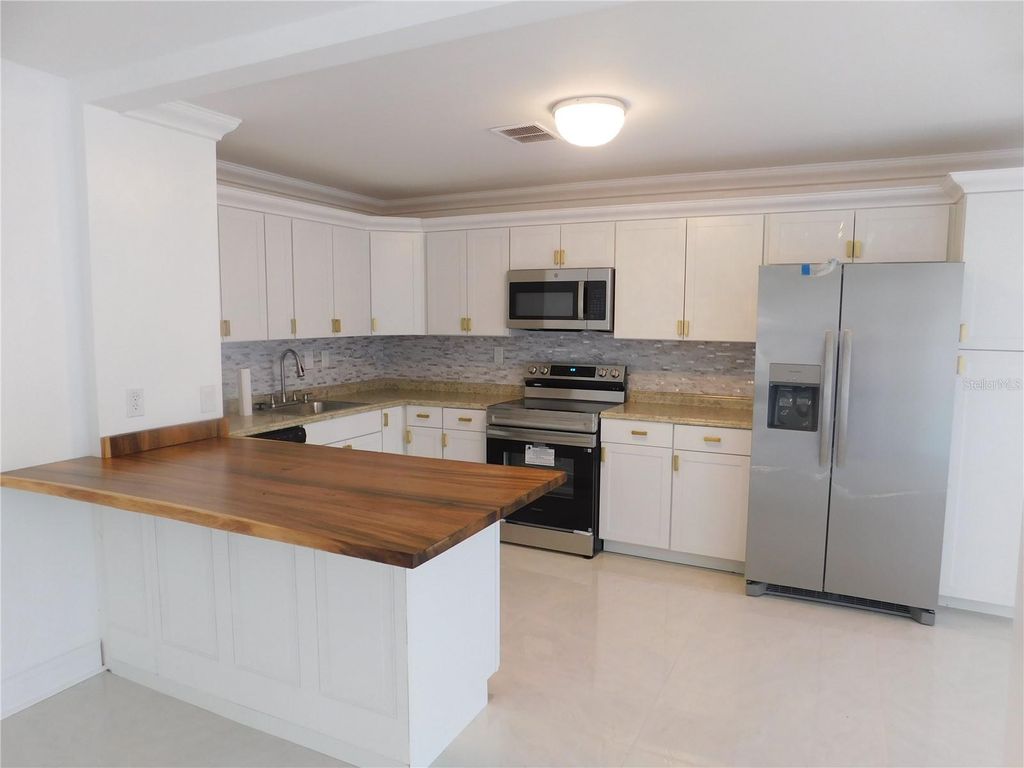 Photo of 2233 Springwood Circle W, Clearwater, FL 33763 (MLS # TB8454351)