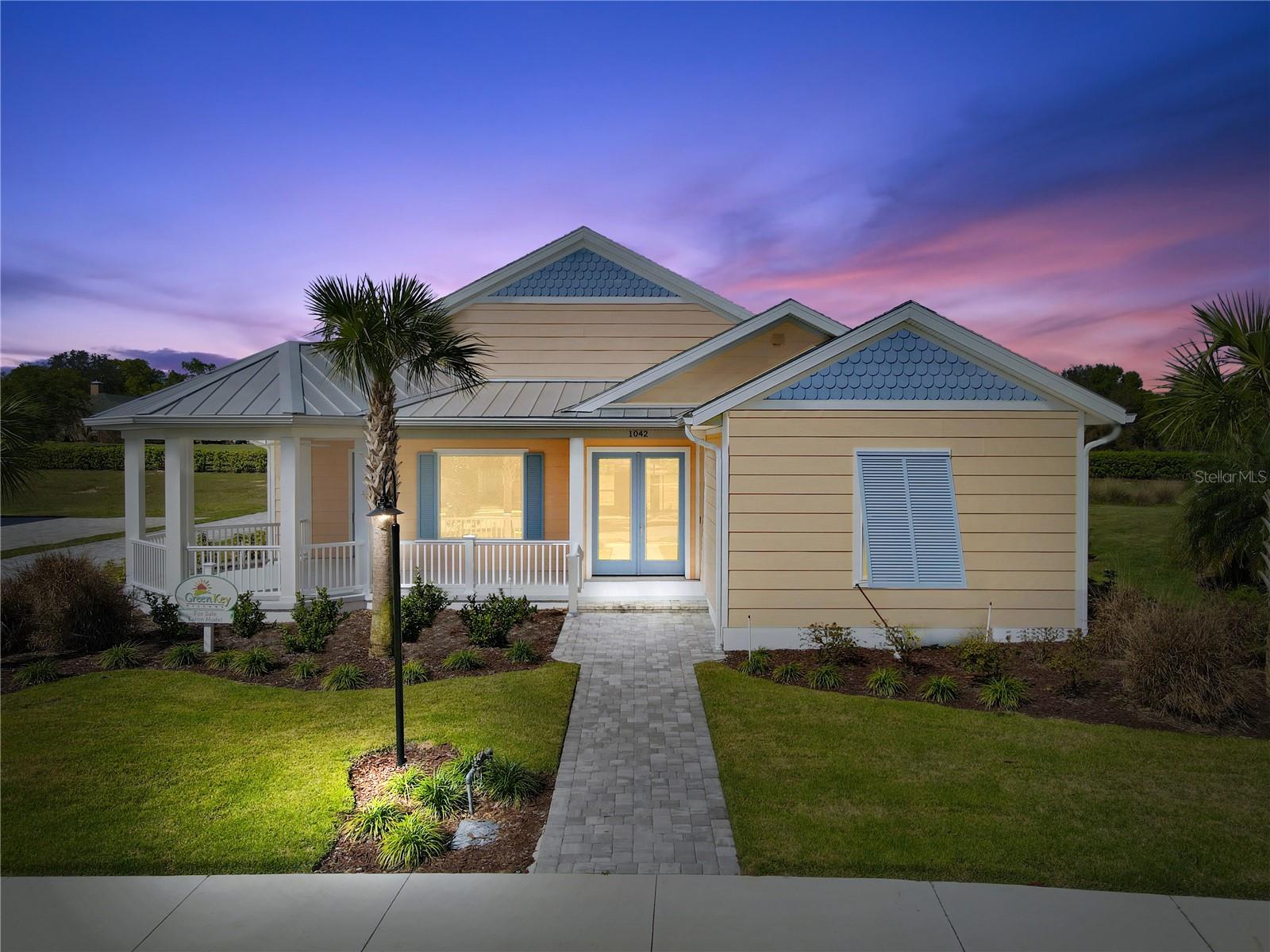 Enjoy coastal living at its best! Just walk up to the front porch of your SOLAR POWERED home and let the Bahama shutters, bright colors, and beauty transport you to the islands! The first thing you see is the happiest gazebo-style front porch on earth, you know this is the home where you truly belong. Step inside the 3 bedroom, 2 bath Eaton floor plan and marvel at the magic of a living space with just as much personality and heart as you. From the spacious kitchen and living room to the gorgeous primary suite featuring a free-standing soaking tub, every inch of this home reflects classic Florida charm. You will love the living room cathedral ceiling highlighted by shiplap and beams. With 3,892 total square feet of stunning wide-open space, you'll always feel like your best self when you're here.