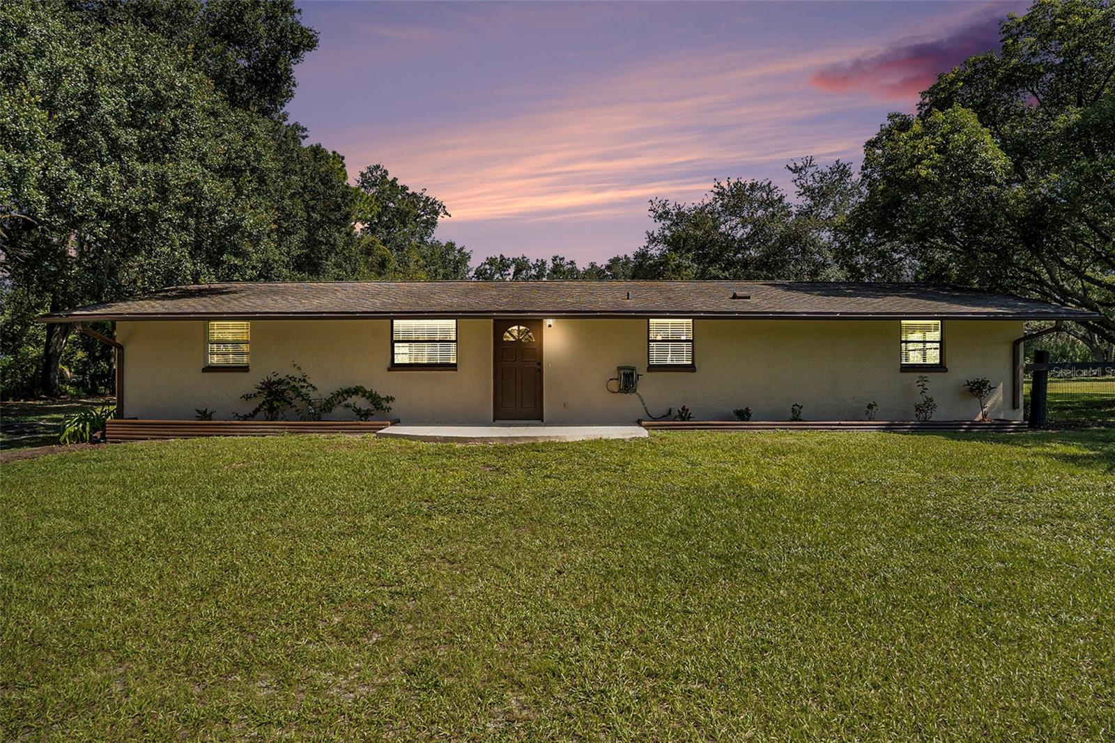 Private Oasis on 1.06 Acres – 3 Bedroom, 2 Bath Home with Detached 3-Car Garage!
Welcome to Your Florida Home at 39349 Comstock Lane, a move-in ready gem offering modern updates, privacy, and freedom with no HOA or deed restrictions. It sits on a fully fenced 1.06-acre lot, this home is ideal for families, first-time buyers, or anyone looking to downsize into their own private retreat.
Step inside and you’ll find a bright open floor plan with new tile flooring throughout. The updated kitchen shines with granite countertops, stainless steel appliances, and a large island perfect for casual dining. Thoughtful details include under-cabinet LED lighting, recessed lighting in the living and family rooms, and ceiling fans in every bedroom and the breakfast nook. A convenient pass-through window connects the kitchen to the dining area, making gatherings effortless.
The primary suite features an ensuite bathroom complete with a whirlpool tub and shower, offering a perfect spot to unwind. Two additional bedrooms and a second full bathroom provide comfort and space for family or guests.
Enjoy year-round Florida living with the versatile screened back patio. Its unique design allows you to slide open the doors to park a vehicle or close them to create a fully enclosed entertainment space for parties and get-togethers.
Practical updates bring peace of mind with a 4-year-old roof, brand-new water heater, and ice-cold central A/C. The property also includes washer/dryer hookups and a detached 3-car garage, offering ample storage and parking.
**Key Features:**
3 Bedrooms | 2 Bathrooms | Open Floor Plan
1.06 Acres – Fully Fenced for Privacy
Updated Kitchen w/ Granite, Stainless Steel, LED Lighting
Screened Patio – Convertible for Parking or Entertaining
Master Suite w/ Whirlpool Tub & Shower
Detached 3-Car Garage
4-Year-Old Roof, New Water Heater, Strong A/C
This home is the perfect balance of modern comfort, privacy, and flexibility — a rare find in Zephyrhills!