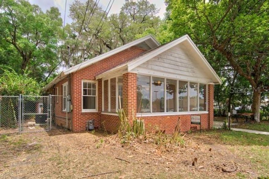 Exceptional Investment Opportunity Near UF Campus! Located right on the edge of the University of Florida, this unique property features two income-generating dwellings and additional paid parking—perfect for investors or future owner-occupants. The main house has projected rent of $2400 per month and includes 3 bedrooms, 1.5 bathrooms, hardwood floors, a cozy fireplace, spacious living and dining areas, a washer/dryer, and a private courtyard. Two of the bedrooms feature its own vanity for added convenience. Tucked behind the main home is a fully leased studio cottage, generating consistent rental income through July 2026. The property also includes 10 additional paid parking spots, boosting its income potential even further. Live in the main house, rent out the studio and parking, or lease both for maximum returns. Just steps from UF, this is a rare chance to own prime real estate in a high-demand rental area!