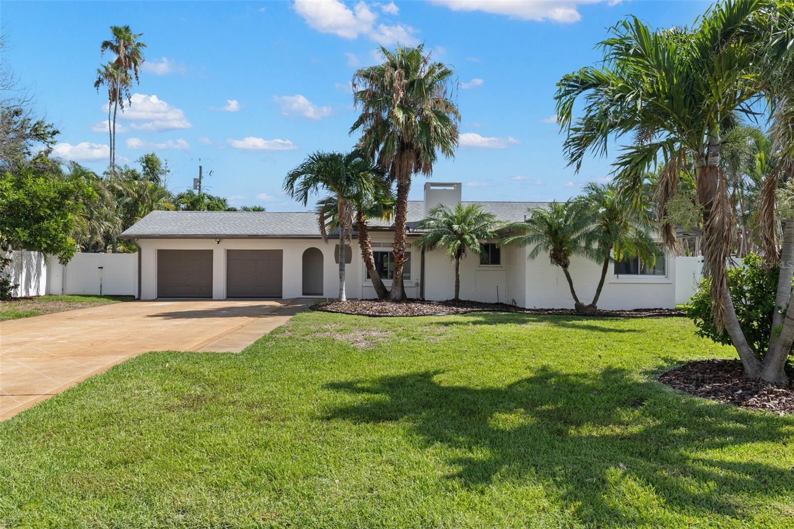 From the outside in, this 4 bedroom/3 bath home in Belleair Beach has been updated and renovated to bring it into the 21st century!! "NEW" kitchen, baths, flooring, fixtures, lighting, interior doors and neutral fresh paint inside and outside. Kitchen features NEW hard surface counters, cabinets, and stainless appliances. All of the baths feature NEW cabinets, hard surface vanities, lighting and fixtures. Did you see the primary walk-in shower? WOW! Enjoy the pool on those HOT Florida days and relax on the covered lanai. Privacy provided by the white vinyl fencing. Less than 2 blocks to the Gulf of America and Clearwater Harbor. This home is move-in ready, so make this concrete block/stucco YOURS in 2025!