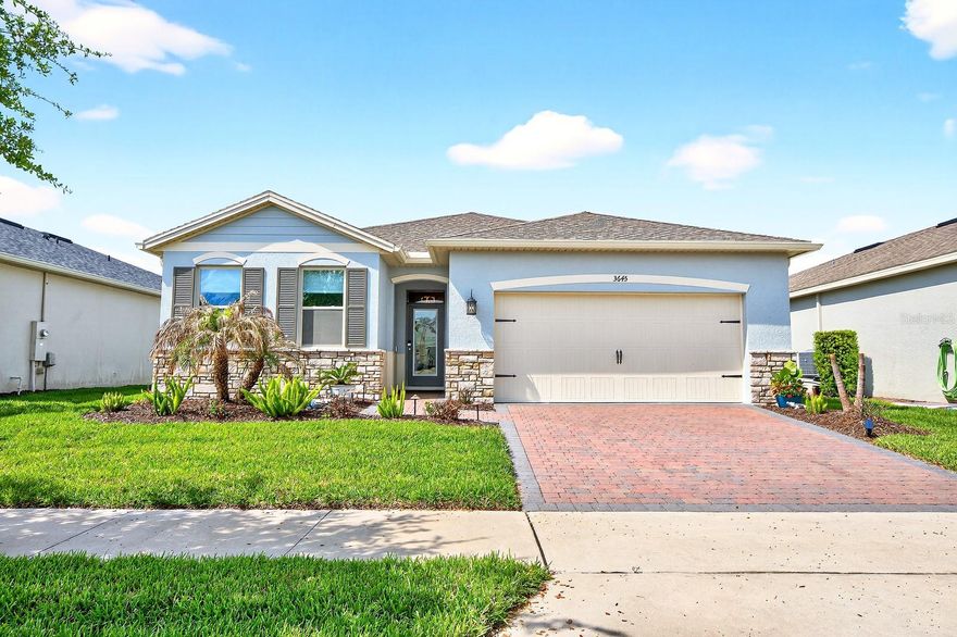 Welcome to low-maintenance, RESORT STYLE LIVING in the highly sought-after 55+ community of Palms at Serenoa in Clermont – a home that is truly MOVE IN READY and shows like a model! Major updates and upgrades have already been taken care of for you, starting with a NEW ROOF (2023), followed by EXTERIOR PAINT & GUTTERS (2025), NEW CARPET in the bedrooms (2025), and a SHARK-COATED GARAGE FLOOR (2025). The outdoor living space has been thoughtfully enhanced with resealed pavers and added lanai drainage (2026), while earlier improvements include stonework on the front elevation (2024), wainscoting accents (2024), wood window trim and sills (2024), updated light fixtures (2023), and a CUSTOM GLASS INSET FRONT DOOR (2022). Even the finer details have been handled, with INTERIOR PAINT (2022), FENCED YARD (2021), SCREENED LANAI (2021), and ceiling fans (2021). Built in 2020 and impeccably maintained, this 4-bedroom, 2-bath home offers a light, bright OPEN CONCEPT layout designed for both everyday living and easy entertaining. TILE FLOORING runs throughout the main living areas, while the bedrooms feature fresh, comfortable carpeting. The kitchen flows seamlessly into the living and dining spaces, all framed by OVERSIZED SLIDING GLASS DOORS that open to one of the home’s best features – a large screened lanai with an EXTENDED PAVER PATIO overlooking a peaceful WATER VIEW. The backyard is fully fenced, creating a private space to relax and enjoy the serene setting. The spacious PRIMARY SUITE is thoughtfully positioned for privacy and offers a comfortable retreat, while the additional bedrooms provide flexibility for guests, hobbies, or a home office. Life in Palms at Serenoa is all about lifestyle! Residents enjoy a resort-style pool, clubhouse, fitness center, and a full calendar of social activities, all set within a beautifully landscaped and welcoming community known for its friendly neighbors and active atmosphere. Conveniently located with easy access to US Hwy 27, you are just minutes from shopping, dining, and everyday essentials, with quick access to Orlando’s world-class attractions, golf, and recreation. If you have been searching for a home that combines modern upgrades, a peaceful water view, and an active lifestyle, Blue Sage Loop checks all the boxes. Call today to schedule a tour!