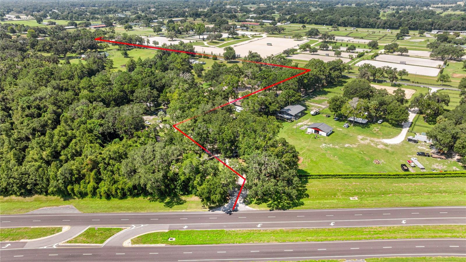 Turnkey Equestrian Compound Directly Across from HITS Post Time Farm! AND ONLY 12 MILES TO THE WORLD EQUESTRIAN CENTER OCALA FL.
An exceptional opportunity to own a fully operational, income-producing equestrian facility on over 7.5 acres in one of the most coveted locations in Ocala — directly across from the world-renowned HITS Post Time Farm.
This meticulously maintained property includes 5 updated residential cottages and top-tier equine amenities, making it ideal for investors, trainers, or equestrian professionals.
Residential Cottages
• Cottage 1: Fresh paint, new appliances, walk-in tiled shower, new toilet, ceiling fans
• Cottage 2: New paint, new ceiling fans, new toilet & vanity
• Cottage 3: Fireplace, new flooring, fresh paint, new vanity, fenced backyard
• Cottage 4: Brand new deck, fresh paint
• Cottage 5 (currently being finished): New kitchen, flooring, fans, toilet, vanity, and windows
Equestrian Facilities
• 3 barns with 23 stalls (12x12) — most with fans and automatic waterers
• Liquid rubber flooring in stalls, epoxy-coated wash bays, updated electrical, washer/dryer hookups
• 9 turnout paddocks with fencing
• 60,000 sq ft professional riding arena with sprinkler system and observation deck
• 3 covered wash stalls, 2 tack rooms, dog runs, and 2 gated entrances
• 10 RV hookups (50 Amp) with water and sewer clean-outs
Property Enhancements
• Freshly painted fencing with many new boards
• Extensive dead tree removal for a clean and safe environment
Income Potential
• Current achievable revenue: ~$25,000/month off-season | ~$40,000+/month in season
• Achievable cap rate: 9–11% through stall rentals, Airbnb stays, event hosting, parking, and referrals
• In-season stall rentals: $400–500/week (includes turnout & arena use)
This versatile and high-yield property is truly turnkey — ideal for seasonal business or full-time operation. With its proximity to major events and showgrounds, the demand is built-in.
Don’t miss this rare opportunity. Whether you’re an equine investor, trainer, or entrepreneur, this property is ready to deliver value from day one.
Learn more about HITS at hitsshows dot c o m