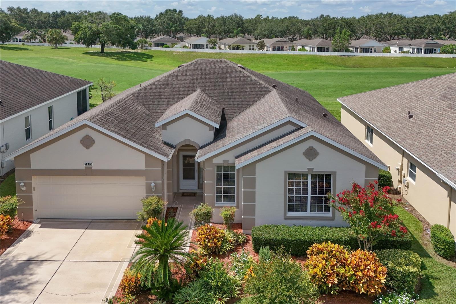 Welcome to Resort Style Living. This Beautifully Maintained St. James Model with 3 Bedrooms, 2 Bathrooms is 2031 SQ. FT. Home Nestled on the Third Hole of the Championship Golf Course in the Lancaster Neighborhood. New AC in 2021 and the Roof was Replaced in 2014. The Gated Golf Community Of Kings Ridge Offers A Multi-Million $ Clubhouse, Spas, Swedish Sauna, Tennis, Boccie, Shuffleboard, Basketball Courts, Card Rooms, Billiards, Bingo, Arts And Crafts. If You Don’t Like Driving Cars, Then Get A Golf Cart And Ride To The Supermarket, Restaurants, Banks, And Beauty Salon & Many More Shops In Kings Ridge Plaza. Maintenance Fees Include Lawn Care, Exterior House Painting, 24 Hour Security And Basic Cable. Easy Commute to Disney, Orlando Airports. Golf Cart is Available for Sale.
