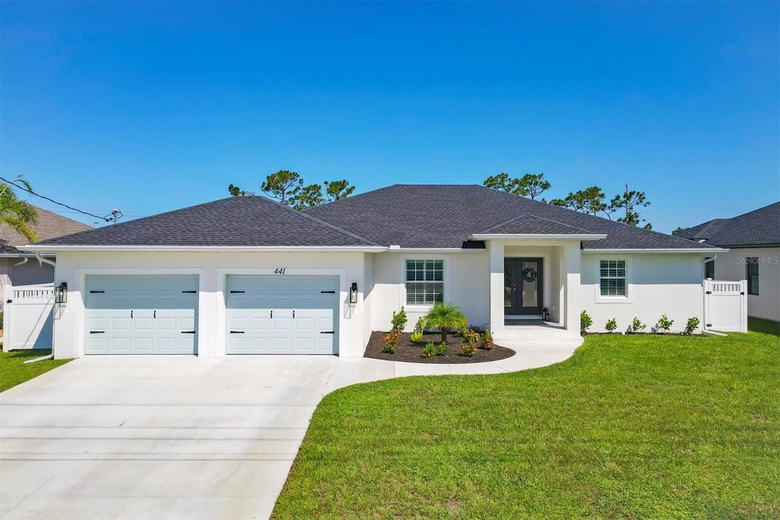 Why settle when you can have it all? This CUSTOM-BUILT 2024 POOL HOME showcases multiple builder and owner upgrades and is located in the highly sought-after golfing community of Rotonda West. Designed for both style and function, this tastefully crafted residence features a bright, open-concept split floorplan that perfectly separates the private primary suite from bedrooms 2 and 3 with their own guest bath, ensuring privacy and comfort on opposite sides of the home. Plus, a flex space that can be used as a home office, gym or 4th bedroom.
The interiors are adorned with custom high-efficiency lighting and fans, tray ceilings with extra lighting, sleek 5¼” base trim, and WOOD PLANK PORCELAIN TILE FLOORS THROUGHOUT. The gourmet kitchen boasts timeless white cabinetry, a double pantry, a custom backsplash, and BEAUTIFUL LEVEL 3 QUARTZ COUNTERTOPS throughout the home, while the custom bar with CUSTOM STAINED CEDAR OPEN SHELVES adds a touch of fun and functionality. The dedicated interior laundry room with sink and modern blue cabinetry add both convenience and personality. The primary suite is a true retreat, offering dual closets, a separate sliding glass door to the pool, custom tile work in the walk-in shower and large linen closets in each bathroom for added storage and organization.
This home was built for entertaining and enjoying the Florida lifestyle. The open layout flows to an EXPANSIVE COVERED PATIO and a HEATED POOL with SHIMMERING TILES, a SUNSHELF FOR LOUNGING, and a convenient outdoor shower. A SLEEK WHITE 6-foot PRIVACY FENCE WITH DEDICATED DOG RUN and a HUGE BACKYARD ensure plenty of space for gatherings, play, and relaxation. The oversized garage with EXPOXY FLOORING and OVERHEAD storage—provides the space of a three-car garage with just two doors. PLANTATION SHUTTERS, CUSTOM SHIPLAP AND BOARD-AND-BATTEN DETAILS, AND HURRICANE-IMPACT WINDOWS AND SLIDERS complete the thoughtful design.
Located on a prestigious street with ESTATE SIZES HOMESITES (14,404 sf), this property offers both peace of mind and incredible value. Situated in an X flood zone for significant insurance savings, Rotonda West provides an aesthetically pleasing community with low HOA fees and unmatched amenities, including five nearby golf courses, a central park with playground, tennis courts, RV/boat storage, and close proximity to the pristine beaches of Boca Grande and Manasota Key. Just minutes from dining, shopping, and endless recreation, this is Florida living at its finest. Best of all, this home is within walking distance via sidewalks to A-rated elementary and middle schools, making it as convenient for families as it is beautiful.
Why buy new and spend thousands more on upgrades when this home—PRICED TO SELL WITH ALL OF THE UPGRADES ALREADY DONE—lets you step right into the lifestyle you’ve been dreaming of? Schedule your showing today to experience the quality, style, and elegance this home offers!