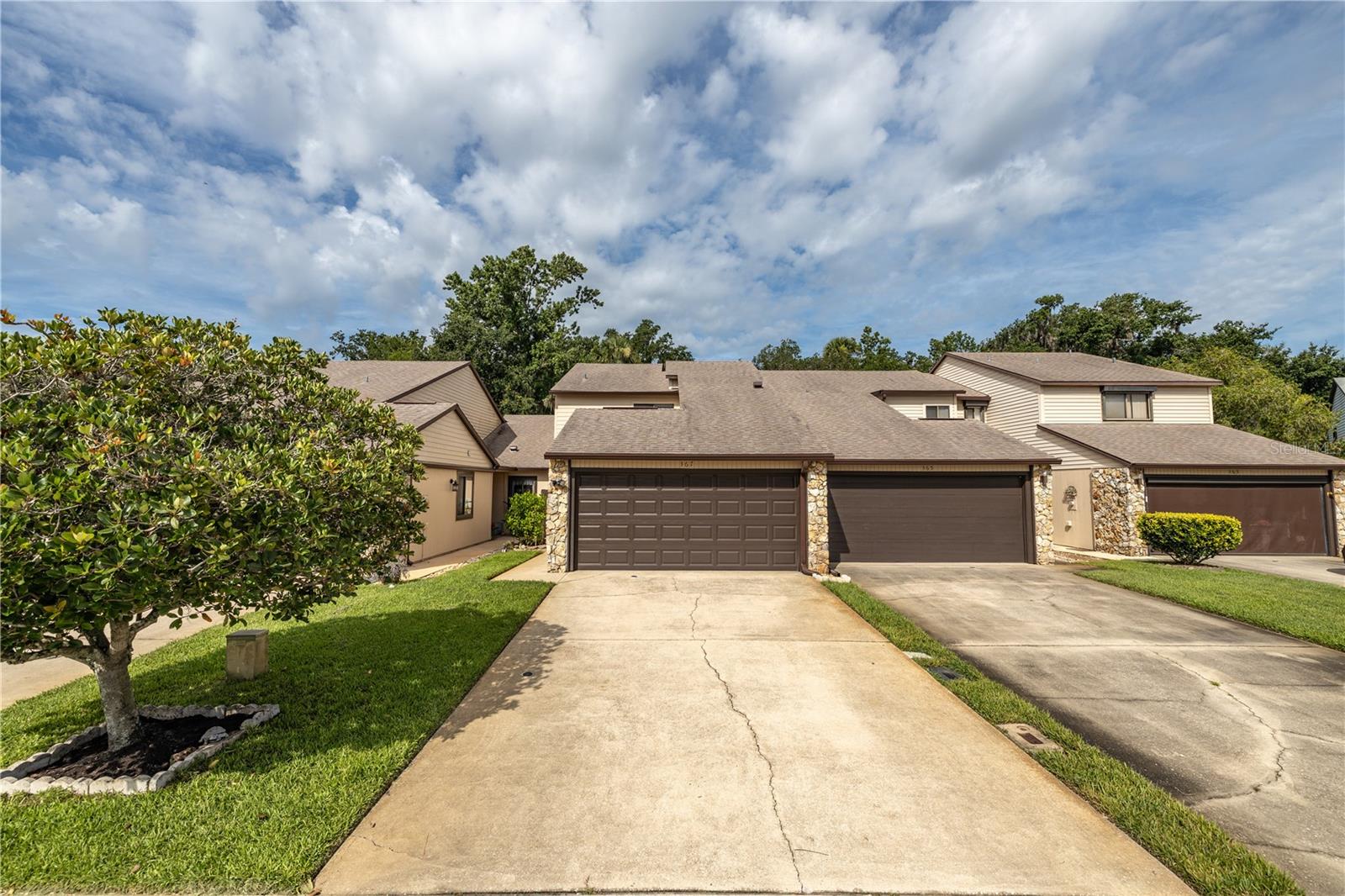 Located in the desirable Hidden Pines community, this well-maintained two-bedroom, two-and-a-half-bath, 2 car garage townhome offers comfort, convenience, and a peaceful setting just minutes from shopping, dining, and the beautiful beaches of New Smyrna.
As you enter, you’re greeted by a spacious open-concept living and dining area, perfect for both relaxing and entertaining. The area features plenty of natural light and offers a comfortable flow that leads directly into the large, well-equipped kitchen. The kitchen provides abundant cabinet space, a full appliance package, and a breakfast bar that opens to the living space — ideal for casual dining or hosting friends and family.
Just off the living room, sliding glass doors lead to a screened-in patio overlooking a beautifully landscaped open area. This peaceful space is perfect for enjoying your morning coffee, reading a book, or unwinding in the evening while taking in the quiet Florida scenery.
The primary bedroom is located downstairs, offering privacy and easy accessibility. It features a large walk-in closet and an en suite bath with a walk-in shower and extended vanity. The layout makes it ideal for those who prefer first-floor living or need easy access without stairs. A half bath is also conveniently located on the main level for guests, and storage closets throughout the first floor offer practical space for everyday living.
Upstairs, you’ll find a spacious loft area with a walk-in closet — a versatile space that can be used as a home office, den, media room, or guest retreat. The second bedroom also sits upstairs and includes a private en suite bath with a shower/tub combination and ample closet space, making it perfect for family, guests, or roommates seeking comfort and privacy.
The attached two-car garage provides plenty of room for vehicles and additional storage. Inside, you’ll find a washer and dryer, utility sink, and an extra refrigerator — all designed for convenience and functionality.
Hidden Pines is a well-established community known for its quiet atmosphere and excellent amenities. Residents enjoy access to a community pool, hot tub, tennis and pickleball courts, and a clubhouse for gatherings and events. This townhome is conveniently located directly across from the tennis and pickleball courts, offering easy access to recreational fun. Centrally located, Hidden Pines is just minutes from local shops, grocery stores, restaurants, and the white-sand beaches of New Smyrna Beach. With easy access to major roadways, commuting to nearby cities or exploring Florida’s coastal attractions is effortless.