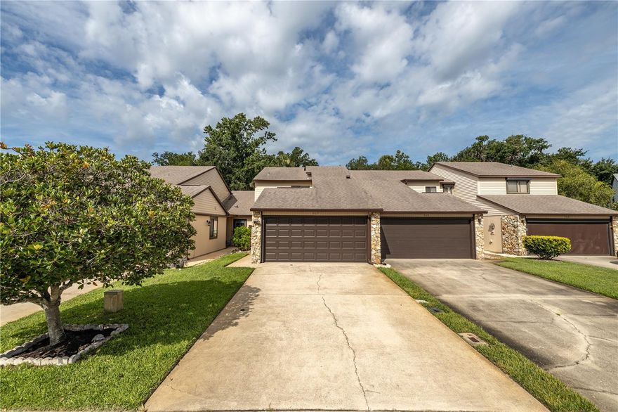 Located in the desirable Hidden Pines community, this well-maintained two-bedroom, two-and-a-half-bath, 2 car garage townhome offers comfort, convenience, and a peaceful setting just minutes from shopping, dining, and the beautiful beaches of New Smyrna.

As you enter, you’re greeted by a spacious open-concept living and dining area, perfect for both relaxing and entertaining. The area features plenty of natural light and offers a comfortable flow that leads directly into the large, well-equipped kitchen. The kitchen provides abundant cabinet space, a full appliance package, and a breakfast bar that opens to the living space — ideal for casual dining or hosting friends and family.

Just off the living room, sliding glass doors lead to a screened-in patio overlooking a beautifully landscaped open area. This peaceful space is perfect for enjoying your morning coffee, reading a book, or unwinding in the evening while taking in the quiet Florida scenery.

The primary bedroom is located downstairs, offering privacy and easy accessibility. It features a large walk-in closet and an en suite bath with a walk-in shower and extended vanity. The layout makes it ideal for those who prefer first-floor living or need easy access without stairs. A half bath is also conveniently located on the main level for guests, and storage closets throughout the first floor offer practical space for everyday living.

Upstairs, you’ll find a spacious loft area with a walk-in closet — a versatile space that can be used as a home office, den, media room, or guest retreat. The second bedroom also sits upstairs and includes a private en suite bath with a shower/tub combination and ample closet space, making it perfect for family, guests, or roommates seeking comfort and privacy.

The attached two-car garage provides plenty of room for vehicles and additional storage. Inside, you’ll find a washer and dryer, utility sink, and an extra refrigerator — all designed for convenience and functionality.

Hidden Pines is a well-established community known for its quiet atmosphere and excellent amenities. Residents enjoy access to a community pool, hot tub, tennis and pickleball courts, and a clubhouse for gatherings and events. This townhome is conveniently located directly across from the tennis and pickleball courts, offering easy access to recreational fun. Centrally located, Hidden Pines is just minutes from local shops, grocery stores, restaurants, and the white-sand beaches of New Smyrna Beach. With easy access to major roadways, commuting to nearby cities or exploring Florida’s coastal attractions is effortless.