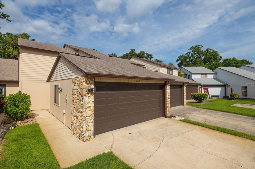 Located in the desirable Hidden Pines community, this well-maintained two-bedroom, two-and-a-half-bath, 2 car garage townhome offers comfort, convenience, and a peaceful setting just minutes from shopping, dining, and the beautiful beaches of New Smyrna.

As you enter, you’re greeted by a spacious open-concept living and dining area, perfect for both relaxing and entertaining. The area features plenty of natural light and offers a comfortable flow that leads directly into the large, well-equipped kitchen. The kitchen provides abundant cabinet space, a full appliance package, and a breakfast bar that opens to the living space — ideal for casual dining or hosting friends and family.

Just off the living room, sliding glass doors lead to a screened-in patio overlooking a beautifully landscaped open area. This peaceful space is perfect for enjoying your morning coffee, reading a book, or unwinding in the evening while taking in the quiet Florida scenery.

The primary bedroom is located downstairs, offering privacy and easy accessibility. It features a large walk-in closet and an en suite bath with a walk-in shower and extended vanity. The layout makes it ideal for those who prefer first-floor living or need easy access without stairs. A half bath is also conveniently located on the main level for guests, and storage closets throughout the first floor offer practical space for everyday living.

Upstairs, you’ll find a spacious loft area with a walk-in closet — a versatile space that can be used as a home office, den, media room, or guest retreat. The second bedroom also sits upstairs and includes a private en suite bath with a shower/tub combination and ample closet space, making it perfect for family, guests, or roommates seeking comfort and privacy.

The attached two-car garage provides plenty of room for vehicles and additional storage. Inside, you’ll find a washer and dryer, utility sink, and an extra refrigerator — all designed for convenience and functionality.

Hidden Pines is a well-established community known for its quiet atmosphere and excellent amenities. Residents enjoy access to a community pool, hot tub, tennis and pickleball courts, and a clubhouse for gatherings and events. This townhome is conveniently located directly across from the tennis and pickleball courts, offering easy access to recreational fun. Centrally located, Hidden Pines is just minutes from local shops, grocery stores, restaurants, and the white-sand beaches of New Smyrna Beach. With easy access to major roadways, commuting to nearby cities or exploring Florida’s coastal attractions is effortless.