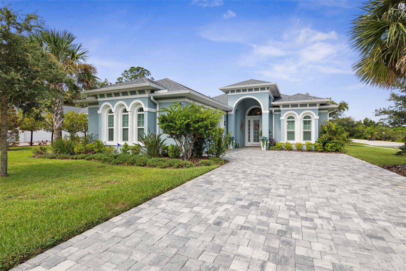 4 bedroom/2 bathroom home in the gated community of Palm Coast Plantation! Looking for a coastal home and relaxing Florida lifestyle? You've found it! This beautiful property encompasses a large primary suite with his/her walk in closets, tub, dual vanities, and walk in shower. Even though every inch of this place is show stopping, the focal point must be the kitchen. Enjoy luxurious amounts of storage and granite counter top space, a walk in pantry, wine fridge, and views of the serene backyard area. All of this beautiful furniture you see in the photos is built into the price! If you enjoy the outdoors you will love this community and its amenities! Walk well maintained sidewalks down every treelined street as well as a nature trail around Emerald Lake. Utilize the recreational facilities that include pickle ball courts (with an active group), large swimming pool, hot tub, fitness center, playground, basketball court, tennis courts, onsite dry boat/RV storage, and docks leading to both Emerald Lake and the Intracoastal waterway. Short drive to both Flagler Beach and Palm Coast. Close to restaurants, entertainment, shopping, nature parks, and more! Come see your dream home!