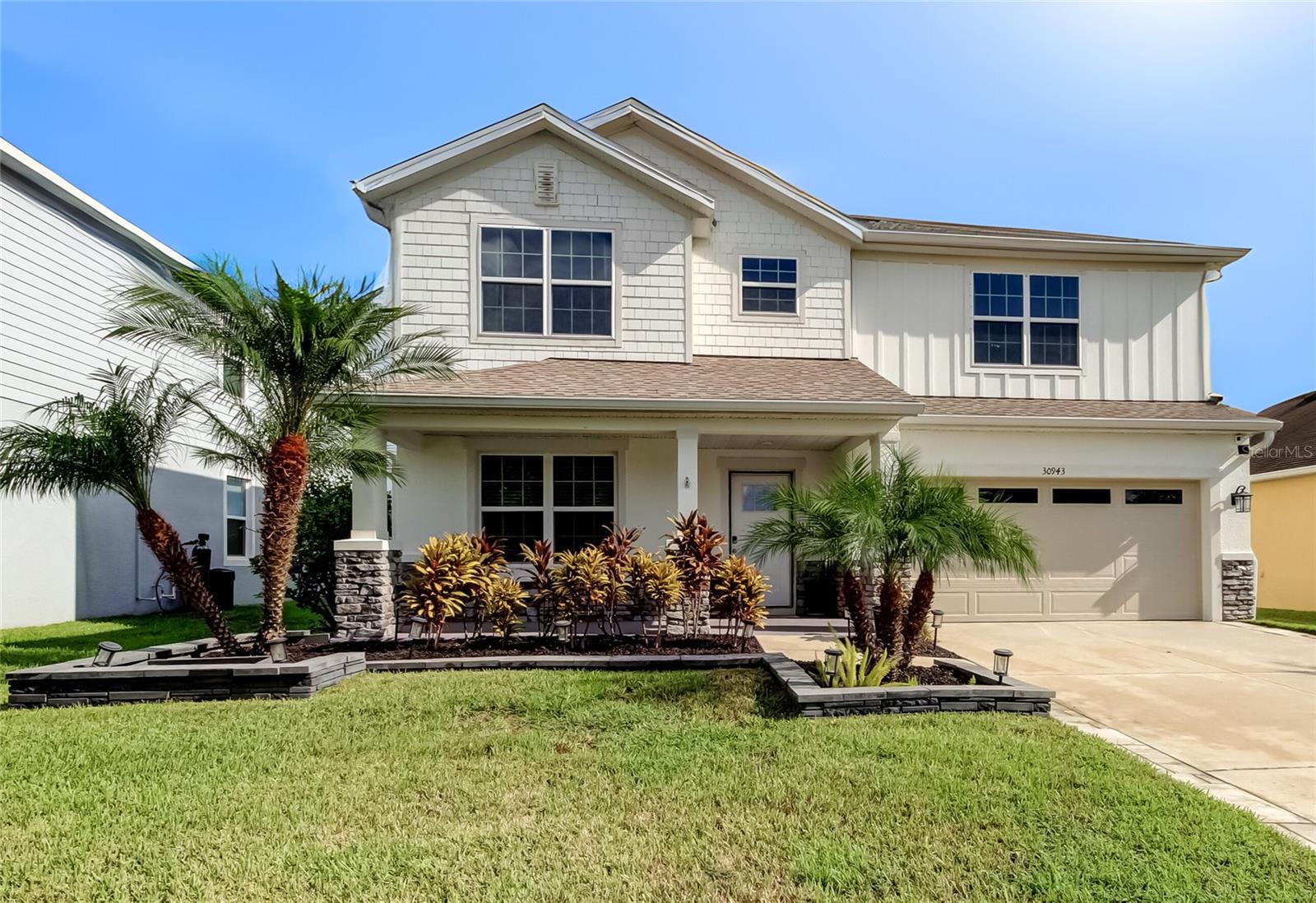 Welcome to Lagoon Living in Epperson! This 6-bedroom + loft home offers space, style, and upgrades throughout. Fresh exterior paint, widened paver driveway, upgraded builder elevation, and tropical landscaping add great curb appeal. Inside, the open kitchen overlooks the dining and living areas and features 42" white cabinets with upgraded hardware, granite countertops, stainless steel appliances, custom backsplash, wood pantry shelving, and water filtration/softener with reverse osmosis. The interior is freshly painted with crown molding, accent walls, and luxury vinyl plank flooring. Flexible front room works as an office, playroom, or formal dining/living space, and there’s a downstairs bedroom with full bath—perfect for guests or multi-generational living. Upstairs you’ll find 5 bedrooms, all with custom closets, plus a loft. The owner’s suite has a tray ceiling, barn door, walk-in closet, and spa-style bath with dual vanities, soaking tub, and walk-in shower. Bathrooms have marble countertops.
Outdoor living includes a covered lanai, extended paver patio, and spacious fenced yard. Added features: 50-amp power inlet box, transfer switch, and upgraded garage storage.
Located in Epperson South, home of the nation’s first Crystal Lagoon with kayaking, paddle boarding, sandy beaches, live music, swim-up bar, dog parks, golf cart paths, and resident-only events. Close to great schools, shopping, dining, and just 35 minutes to downtown Tampa.