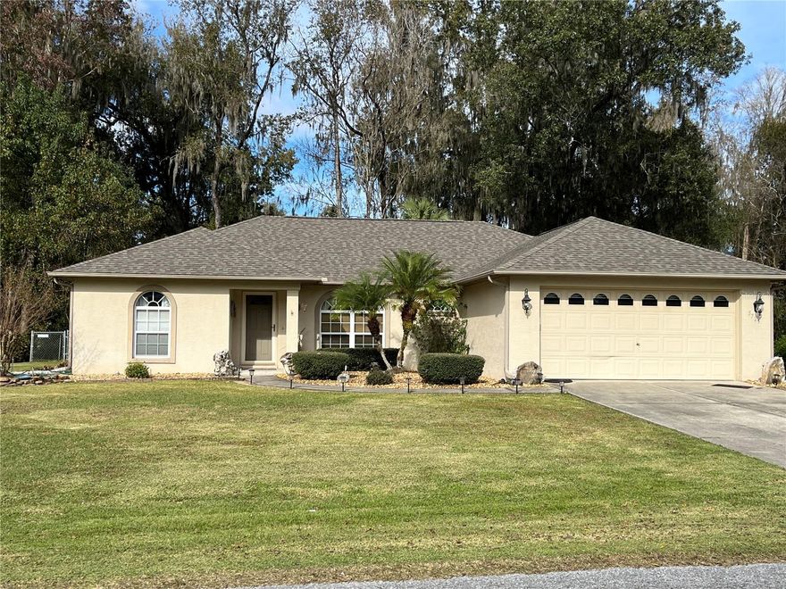 Marco Polo built home in Belleview School District.  3 bedroom plus office/den.  Roof replaced 8/2022.  Air Unit HP replaced 4/2021.  Seperate laundry room.  2 car garage with workbench.  Detached carport sits to the side of the house.  Large screen porch.  Yard extends passed the chain-link fence as fence was installed for two small dogs.