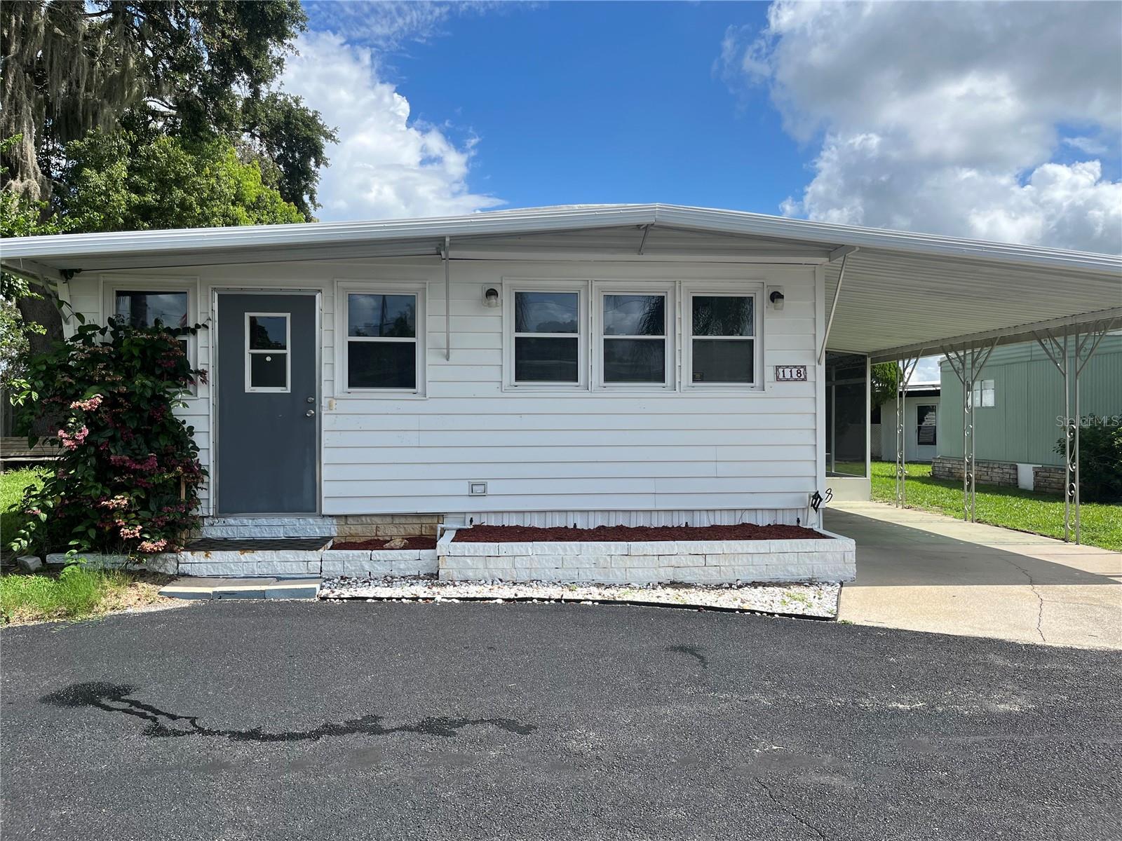 OWNER WILL CONSIDER OWNER FINANCING with 20% down and 5% interest! Discover the serenity of a community of lakeside living in this updated 2-bedroom, 2-bathroom manufactured home nestled in the heart of Brittany Estates, a 55+ community. Embodying the essence of cooperative community living, ownership includes a share granting access to outstanding amenities and a vibrant social scene. Step through the threshold and into a home transformed by thoughtful renovations, featuring state-of-the-art 200 amp underground electrical service and new subflooring paired with contemporary vinyl plank flooring throughout. The front room has been ingeniously repurposed to offer additional living space, perfect for an inviting office or cozy den. Indulge in the Florida sunshine from your own enclosed and screened side lanai, complete with a designated area housing a newer washer and dryer. This versatile space not only extends your living area but also provides a tranquil haven to relax and rejuvenate. Brittany Estates caters to your every whim with a wealth of amenities designed to enrich daily life, including a year-round heated pool for endless enjoyment, and a clubhouse ideal for hosting memorable gatherings. Water enthusiasts will relish the exclusive access to Lake Griffin, with the option, when available, for covered boat slips equipped with lifts. A well-appointed clubhouse offers the perfect setting for socializing with neighbors, while outdoor enthusiasts can partake in friendly games of shuffleboard or horseshoes. For those who appreciate the allure of fishing, a private pier beckons on the shores of Lake Griffin. Conveniently encompassed within the cooperative community, the modest monthly association fee of $157 covers access to all amenities, along with essential services such as grounds maintenance, trash removal, and water and sewer. Don't miss the chance to embrace the quintessential lakeside lifestyle in Brittany Estates. Seller financing options available, inquire with our dedicated listing agent for details. Pet lovers rejoice—this community welcomes one pet weighing up to 25 lbs. Experience the allure of lakeside living at its finest—schedule your private tour today! Contact us now to seize this remarkable opportunity to claim your piece of paradise in Brittany Estates. All information deemed reliable; buyer verification required.