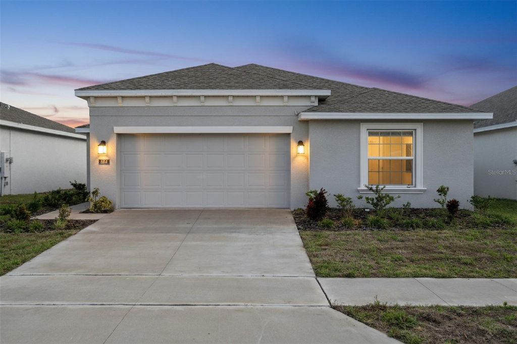 Photo of 664 Sand Pine Lane, Haines City, FL 33844 (MLS # O6373601)