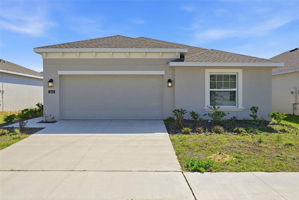 Photo of 664 Sand Pine Lane, Haines City, FL 33844 (MLS # O6373601)