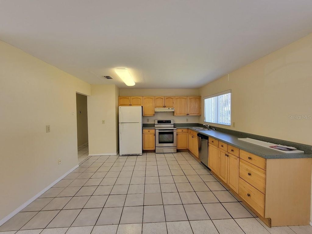 Photo of 2466 Lakeshore Circle, Port Charlotte, FL 33952 (MLS # A4685880)