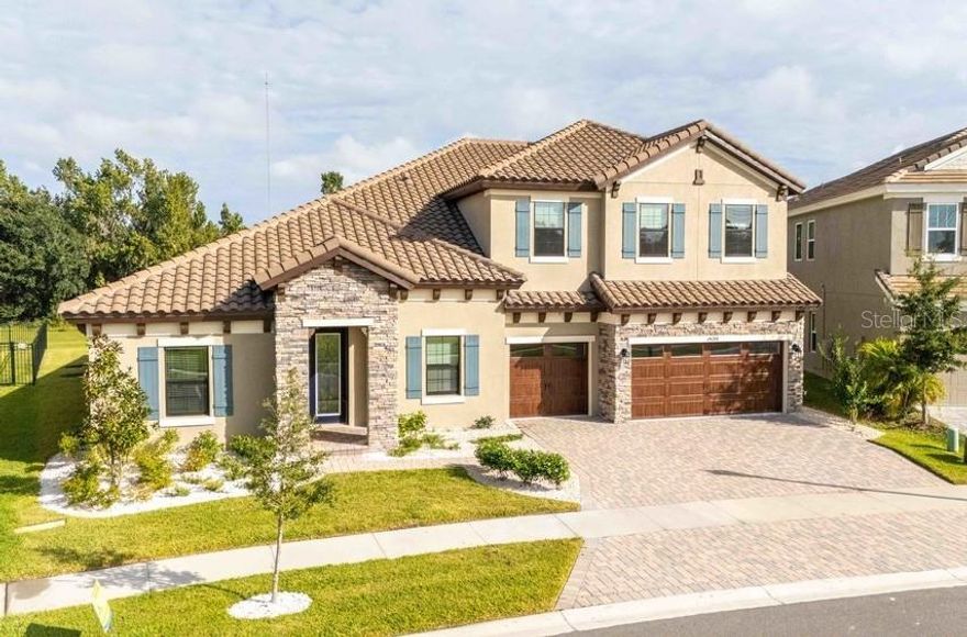 Luxury Living in Lithia – Move-In Ready Home
This exquisite residence combines the elegance of a model home with the comfort of modern living, showcasing premium upgrades throughout. Thoughtfully designed with today’s most sought-after floorplan, this home offers an open-concept layout perfect for entertaining, yet functional for everyday life. Best of all, it’s ready for you to move in now. Featuring 5 bedrooms, 4 bathrooms, a private office, flex room, and two spacious bonus rooms, the home offers versatility to suit any lifestyle. The grand foyer welcomes you into a light-filled great room with soaring ceilings and expansive windows that create a seamless connection to the outdoors. The gourmet kitchen is a chef’s dream, complete with high-end appliances, a large center island, extended built-in dining table, and elegant cabinetry with Kinsdale Maple Slate finishes. Quartz countertops and luxury flooring throughout elevate the home’s aesthetic. A formal dining room sets the stage for unforgettable gatherings with family and friends. Retreat to the lavish primary suite, where a spa-inspired bathroom features a free-standing soaking tub, dual vanities, and a custom walk-in closet designed to impress. Additional bedrooms are generously sized, ideal for family, guests, or creating a personal gym, playroom, or home office. Upstairs, two large bonus rooms with endless possibilities—whether for a media room, game lounge, or private retreat. Set on a premium pie-shaped lot, this home provides privacy and space—truly a rare find. Located in Hawkstone, Lithia’s premier master-planned community, residents enjoy resort-style amenities, top-rated schools, and quick access to US-301 and I-75. Outdoor enthusiasts will love being minutes from the 969-acre Triple Creek Nature Preserve with its pet-friendly hiking trails, or the nearby Triple Creek BMX track for adventure seekers.This is your opportunity to own a fully upgraded, move-in ready home designed for luxury and comfort. Schedule your showing today.