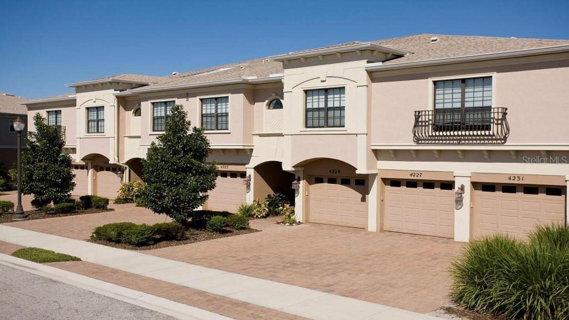 Annual rental located in the sought-after Palma Sola Trace neighborhood, this three-bedroom, two-bathroom condo with a one-car garage is designed for ease and relaxation. This convenient first-floor unit offers a beautiful screened-in lanai to enjoy the serene surroundings. Inside, you'll find a spacious living room/dining room combo, perfect for entertaining guests or simply unwinding after a long day. The inviting kitchen boasts a breakfast bar, ideal for casual dining, and features elegant wood cabinetry that adds a touch of luxury to the space. The primary bedroom is a true retreat, complete with a walk-in closet and private bath featuring a walk-in shower for your convenience. For added convenience, a full-size washer and dryer are located in the hall closet, making laundry day a breeze. The second and third bedrooms offer plenty of space and privacy, ideal for guests or a growing family. Residents of Palma Sola Trace enjoy access to a range of community features, including a lagoon-styled heated pool, fitness center, and clubhouse. Take part in social nights, yoga classes, card games, and book clubs, all without ever leaving the neighborhood. Convenient location near restaurants, shopping centers, healthcare facilities, airports, museums, and the IMG Academy, everything you need is just minutes away. Residents Benefits package added for an additional $35.00 per month. Lawn care, cable, internet, and basic cable included in the rental rate. Owner will accept a small dog.