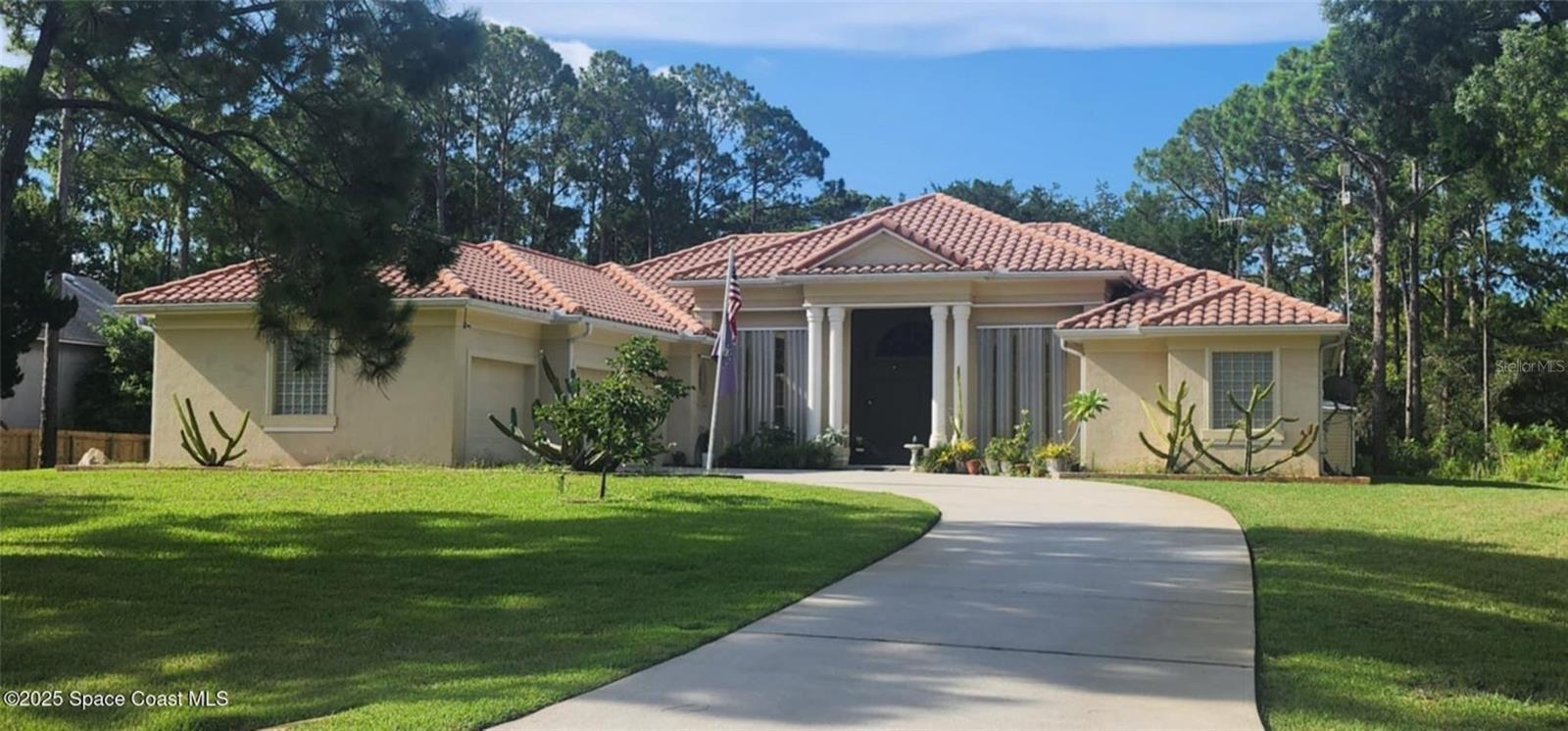Beautifully built 4 bed, 3 bath, 3-car garage custom home with 2,799 sq ft of living space. Thoughtfully designed with stunning architecture, elegant trim, and soaring 20' ceilings in formal areas (12' throughout the rest). The gourmet kitchen includes a Jen-Air drop-in range, wall oven, microwave, and large pantry. The spacious primary suite features his & her closets, Jacuzzi tub, walk-in shower, and double vanity. Guest rooms share a Jack & Jill bath. Detached 1,218 sq ft garage/shop is under air, tiled, with a 14' roll-up door and a half bath plumbed for full. The home also comes equipped with storm panels and a 15kW portable generator. A 15x10 shed offers even more storage, and the washer, dryer, and riding mower will convey with the sale. Located on Florida's renowned Space Coast, just minutes from Kennedy Space Center, rocket launches, beaches, and thriving aerospace industry hubs — a rare blend of craftsmanship and location! Photos to come.
