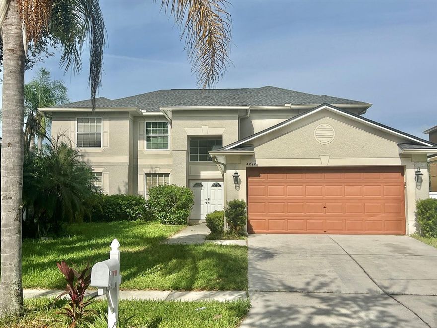 Welcome to this 4/3 Valrico home with an extra DEN/OFFICE and a POOL with a huge screened lanai!  Roof (2020), Two HVAC's (2022, 2024) New Pool Screen & second Screen Door added (2024).....New Microwave & Range (2025).....New garbage disposal (2025).....Newer LVP flooring in Living Room, Den, Laundry Room, and all 3 bathrooms!  Rain Gutters added in 2022.  Backyard is completely fenced-in with newer VINYL FENCING.  As you enter through the front door, you'll immediately appreciate the grandness of this home!  The ceilings in the foyer are two-story, and the gorgeous chandelier adds beauty and sparkle.  An elegant staircase winds around the foyer, and high windows fill the home with natural light.  The kitchen is open to the large great room, and the entire first floor is so ideal for entertaining.  From the kitchen and great room, you have views of the enormous screened-in POOL & LANAI....and there are two sets of sliding glass doors for ease of coming in and going out.  The kitchen features TWO pantries, granite countertops, stainless appliances, and ample cabinet space paired with the two pantries.  There are also additional cabinets in the island as well as the bar that overlooks the great room. Also downstairs are an additional DEN/OFFICE space.....One full bathroom.....and the laundry room.  What a great setup!!!  The Primary Suite is upstairs...and it's a massive 29'x19' room!  The Ensuite features a relaxing Garden Tub, Walk-In Shower, Double Sinks, and a private water closet too!  And the BEST feature of the Primary Suite is the EXPANSIVE WALK-IN CLOSET!  You could actually fit a whole living room set in this closet, and the adorable chandelier will stay!  There are 3 additional bedrooms upstairs with a full bath in the hallway.  Buckhorn Preserve is zoned for Excellent Schools....just 10 minutes from endless DINING & SHOPPING....and only a 30-minute commute to Tampa.  Oh and Disney is just an hour away!  There's a FLOOR PLAN in the photos...and you must see the Virtual Tour!