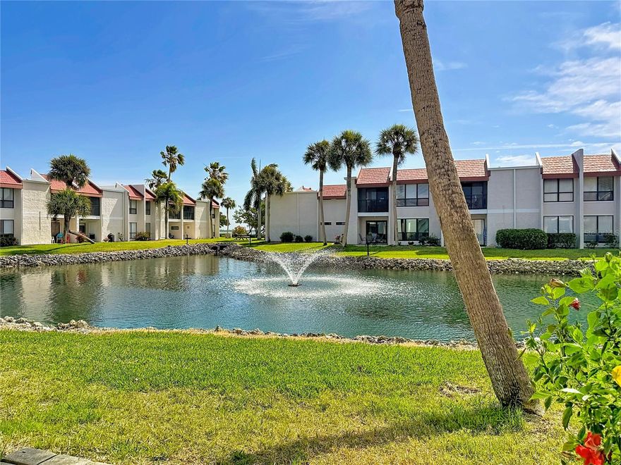 This beautifully renovated, turnkey 2BR/2BA ground-floor unit in the sought-after Runaway Bay community offers serene lake and fountain views along with partial bay views. Fully updated between 2024 and 2025, it features luxury vinyl and tile flooring, quartz kitchen counters, and modern finishes throughout. Major upgrades include new impact windows and entry door (2021), a new Pella impact slider, and a custom roll-shutter and screen system unique to this home. The HVAC and water heater were replaced in November 2024, and the seller is including one year of flood insurance. Ideally located near the beach with two private deeded accesses, the community boasts renovated amenities including a clubhouse, pool, and dock on Sarasota Bay—plus the largest saltwater heated pool on Anna Maria Island. A fantastic chance to own a fully updated, storm-ready home in a prime location.