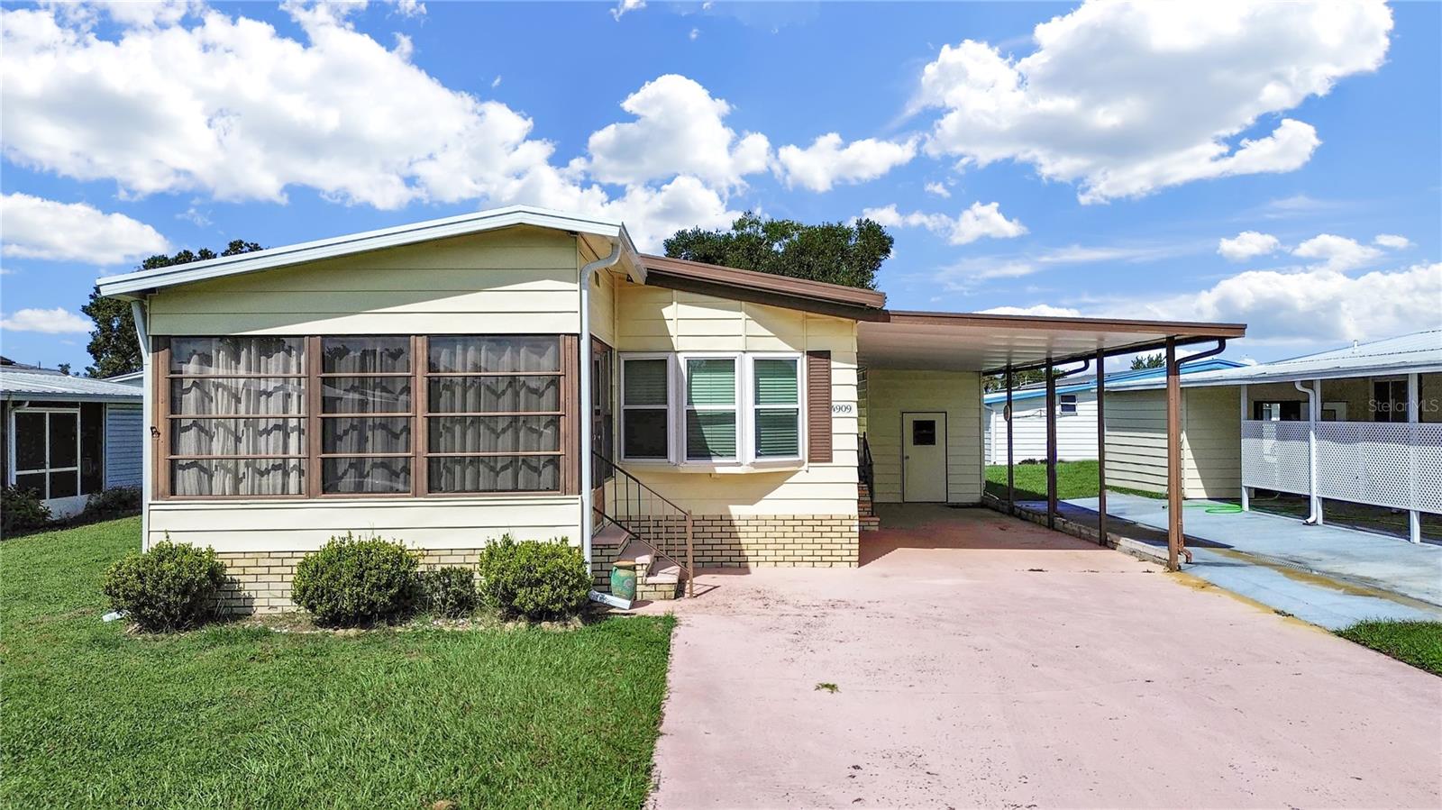 Don't miss this VERY WELL MAINTAINED, FULLY FURNISHED 2 Bedroom, 2 Bathroom home in 55+ Foxwood Lake Estates where you OWN THE LAND!! Many updates on this home include: replaced the AC in 2019, Water Heater 2019, Windows 2017, Washer 2014, Dryer 2016, new Stainless steel Refrigerator 2025, new stove 2025, metal roof-over, just pack your suitcase and move in!! There are wood cabinets in the kitchen, stainless steel sink and faucet, water filtration system under the kitchen sink, dining room has a built-in hutch, spacious living room, updated sink and cabinet in guest bath, all tools in the shed go with the home and much more! Lots of storage and the master closet is so large, you can fit a desk and a chair inside!! Enjoy your morning coffee in the Florida room with a one-of-a-kind hand-painted floor! Take advantage of the very low HOA dues with community features that include a large clubhouse, game room, billiards room, sauna, fitness center, library, large heated pool, hot tub, pickle ball courts, shuffle board courts, bocce ball courts, basketball hoop, paved walking path around the lake and so much more!! Schedule your showing today and join this wonderful community!