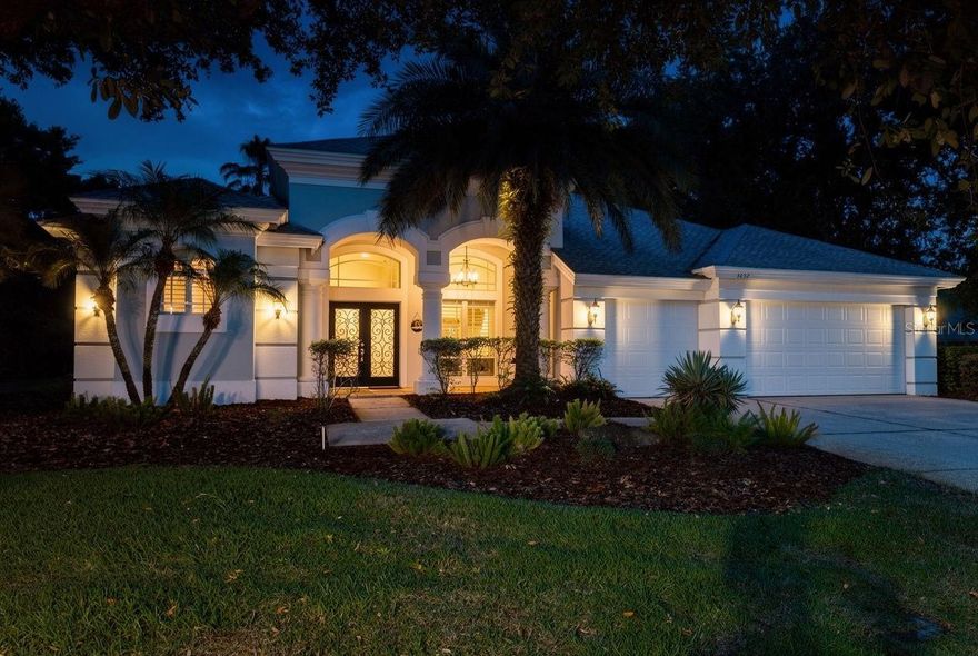 This BEAUTIFULLY-UPDATED home in the heart of East Lake’s much-loved community of Lansbrook is WARM and WELCOMING from the moment you walk through the double front doors! It features four bedrooms PLUS a BONUS ROOM - with a dual-sided FIREPLACE! - that could be used an OFFICE, exercise room, playroom, cozy reading spot, or an additional GUEST BEDROOM! The kitchen’s OVERSIZED ISLAND is a centerpiece for entertaining, with gorgeous MAPLE CABINETS, STAINLESS appliances including a brand new refrigerator, and GRANITE COUNTERTOPS. Overlooking the family room and pool, it’s a perfect setup for SUNDAY FOOTBALL or quiet FAMILY GATHERINGS. The primary ensuite features a GARDEN TUB, separate shower, DUAL SINKS with granite counters, and a CENTER STORAGE CONSOLE with bench. Soft NATURAL LIGHT filters through the windows of the primary bedroom that overlook the POOL, lanai and the OUTDOOR KITCHEN with a BRAND NEW GRILL! An EXTENSIVE AWNING provides additional shade on the screened lanai, with an EXPANSIVE DECK that is perfect for entertaining. Two guest bedrooms share a hall bathroom off the kitchen, and the fourth bedroom has its own PRIVATE ENTRANCE to the pool bath. FRESHLY-PAINTED exterior with a LIFETIME warranty! WELL and SPRINKLER SYSTEM new in 2022! Lansbrook offers two residents-only parks that feature PICKLE BALL and BASKETBALL courts, a SOCCER FIELD, WALKING TRAILS, PLAYGROUNDS, restrooms, and a BOAT RAMP and day docks on Lake Tarpon. With its notable TREE-LINED SIDEWALKS, Lansbrook is close to the YMCA, GOLF courses, RESTAURANTS, shopping, live theater, state and county parks, DOG PARKS and is around the corner from the miles-long PINELLAS BIKE TRAIL. The East Lake community is centrally located, with EASY ACCESS to major highways, 35 minutes to TAMPA INTERNATIONAL AIRPORT, 45 minutes to DOWNTOWN TAMPA and ST. PETE, and half an hour to DOWNTOWN DUNEDIN and its award-winning beach at HONEYMOON ISLAND STATE PARK! Roof and AC: 2010, water heater 2023.