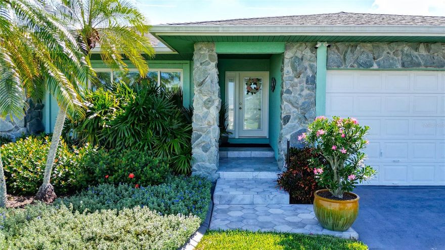 PRICE REDUCED and Sellers are MOTIVATED!  Truly a boaters nirvana and who could ask for more? Introducing your NEXT home. Here is an immaculate and spacious, 3br with 2fb, 2354 sqft. TOTALLY (and I mean totally) remodeled concrete block house with 2 boat lifts located on a deep water, sailboat worthy canal. There's more! Did I mention the 2 car garage, new roof (2022), new gutters and downspouts (2001), brand new composite deck (2024), new sea wall and composite dock (2002), twin covered boat slips with fresh water and electric service (2022). And there is still more! This palatial gem features x-large ceramic tile throughout and most windows are recent additions that are hurricane/storm rated. The kitchen is a gourmet's delight with custom wood cabinets, custom granite counters, top of the line appliances, and a 6 burner commercial grade gas stove. Need more? The pantry/laundry room is large enough to double as a guest suite! The yard is all new (2024) St. Augustine sod all around and features just the right mix of mature landscaping. You'll marvel at the views from the family room, primary bedroom, and kitchen which overlook the canal, your huge new composite wood deck, the dock and boat lifts. Though no one could blame you if you never wanted to leave such a magnificent house, the canal allows easy access with NO bridges to Terra Ceia Bay, the Intercoastal Waterway, and the Gulf of America. And due to the superior elevation of this home there has NEVER been any flooding or water intrusion of any kind. Why wait and take a chance on missing this Beauty in Bay Colony? Time and tide wait for no one. Come See TODAY!