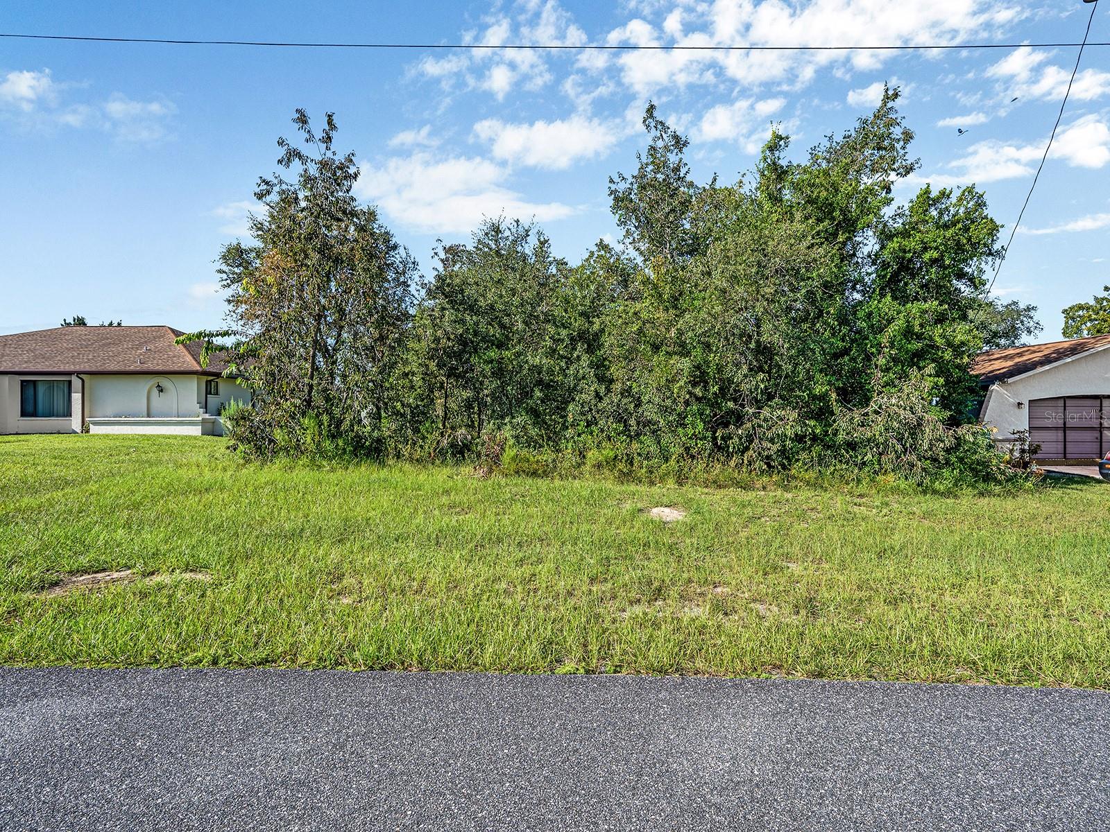 Discover the perfect homesite on this spacious 0.23-acre lot located on a quiet, paved street in the heart of Spring Hill. Zoned PDP (Planned Development Project), this property offers flexible residential building options in a peaceful neighborhood with no HOA and no deed restrictions. The lot measures approximately 80ft by 125ft and is surrounded by established single-family homes. Utilities such as Electric and Water are available nearby (Currently not added to the property), and NO Flood Zone! Conveniently located close to shopping, dining, schools, and medical centers, with easy access to the Suncoast Parkway—making commutes to Tampa, or other areas, fast and simple. Whether you're looking to build now or invest for the future, this lot offers excellent potential in a rapidly growing area of Hernando County.