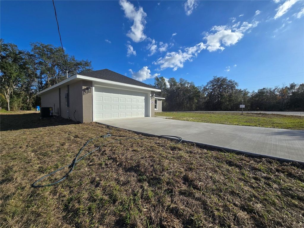 Photo of 245 Locust Pass Ln, Ocala, FL 34472 (MLS # OM715558)