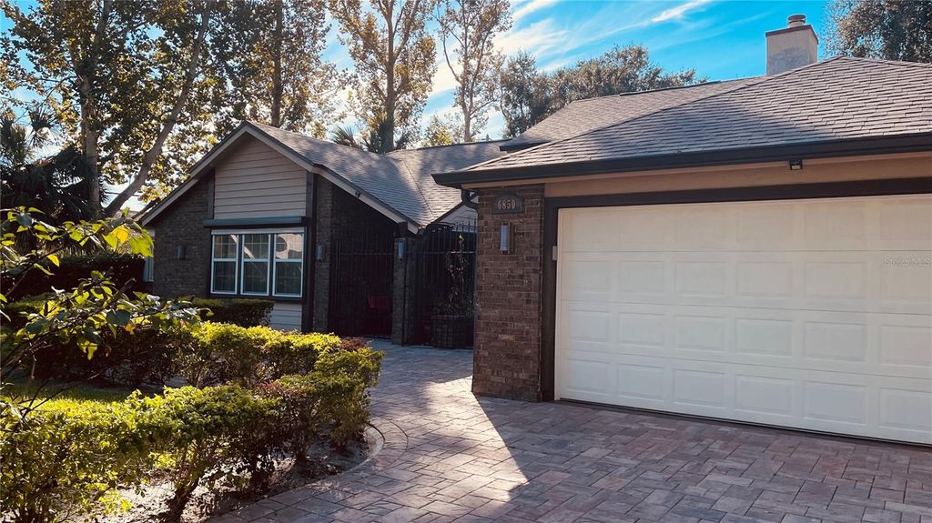 Photo of 6850 Spring Rain Drive, Orlando, FL 32819 (MLS # O6382928)