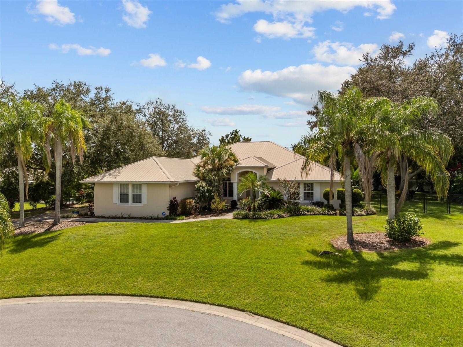 This could be the one you’ve been waiting for! Located in a quiet South Lakeland cul-de-sac, this spacious 4-bedroom, 3.5-bath home sits high and dry on a lush .59-acre lot filled with mature landscaping, fruit trees, and tropical edible plants including avocado, mango, papaya, star fruit, elderberry, ginger, and turmeric.
Inside, you'll find 2,870 square feet of well-designed living space. Vaulted and trey ceilings enhance the open feel of the main living areas, while natural light fills each room. The formal living and dining rooms are perfect for special occasions, and the kitchen/family room combination offers a comfortable setting for everyday living.
The kitchen includes abundant cabinetry, a center island, breakfast bar, built-in desk, and a cozy eat-in area. The family room features a wall of built-in shelving and a wood-burning fireplace, creating a warm and inviting space to unwind.
The split-bedroom layout provides privacy, and the oversized primary suite includes French doors that open to the screened pool area. The en-suite bathroom features dual vanities, a walk-in closet, garden tub, and separate shower.
Step outside to enjoy the Florida lifestyle with an oversized covered patio and a screened-in swimming pool, ideal for entertaining family and friends. A durable metal roof and a spacious 3-car garage offer both peace of mind and plenty of storage.
Conveniently located near top-rated schools, medical facilities, grocery stores, and shopping, this home is a rare find in a highly desirable area.
Call today to schedule your private showing.
