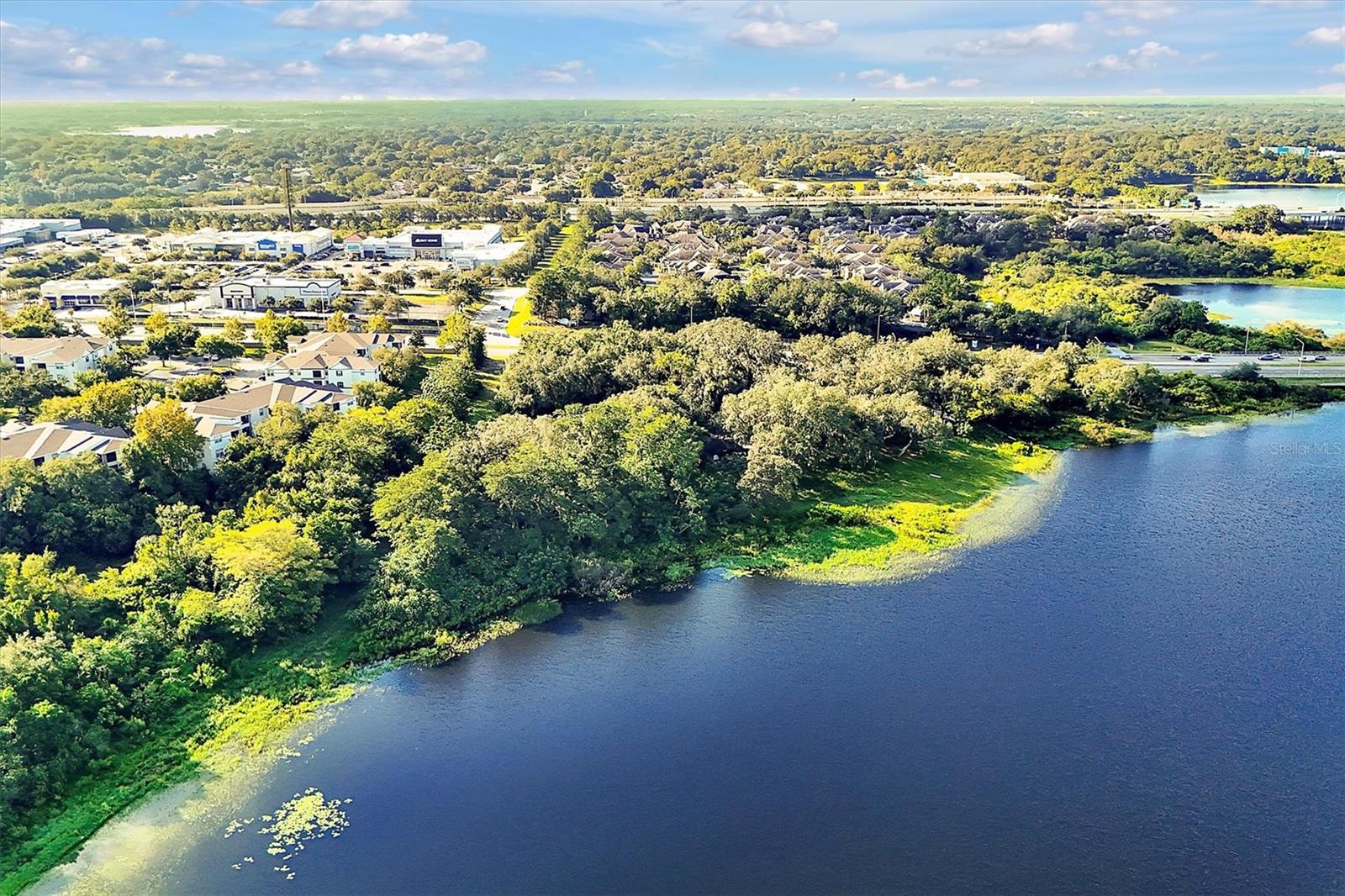 LOCATION, LOCATION, LOCATION...Discover this prime 5.5-acre plot of land, ideally located just minutes from downtown Orlando and strategically positioned between the thriving communities of Winter Garden and Windermere. This prime location offers the perfect blend of accessibility and natural beauty, making it an outstanding opportunity for high-density development. Enjoy easy access to major highways, shopping, dining, and entertainment, all while being able to retreat to your lakeside sanctuary.
The property features a stunning opening to Lake Sherwood, providing a picturesque backdrop for future residential or mixed-use projects. With no association restrictions, you have the freedom to create a unique development tailored to the needs of the community. Surrounded by rapidly growing neighborhoods and just a short drive from Orlando’s vibrant city life, this plot offers significant investment potential. Don’t miss your chance to shape the future of this desirable location.