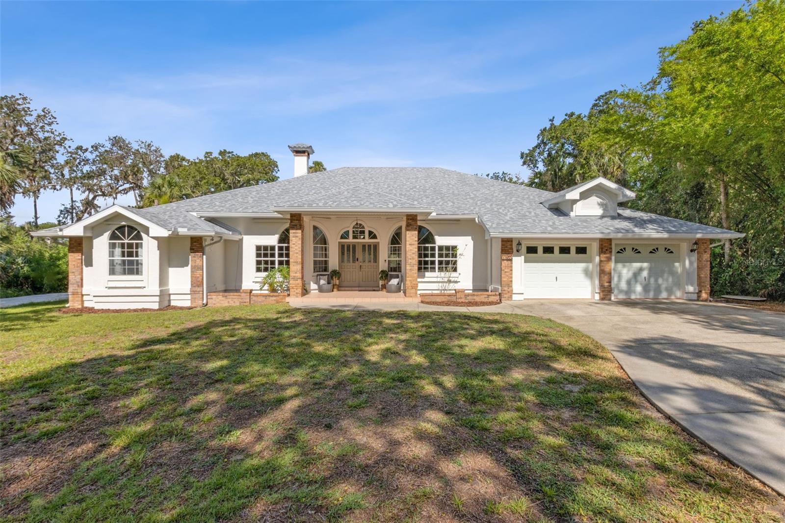 One or more photo(s) has been virtually staged. Welcome to your dream oasis in Flagler Beach! This stunning 4-bedroom, 3-bathroom home is perfectly situated across from the serene Intracoastal Waterway, offering captivating views and refreshing breezes. Nestled on over an acre of lush, private land, this property provides an unparalleled sense of tranquility and space.
As you step inside, you'll be greeted by an open-concept living area that effortlessly combines elegance and functionality. The heart of the living space features a huge, wood-burning brick fireplace, adding warmth and charm to gatherings on cozy evenings. The spacious layout is perfect for entertaining guests or enjoying quality time with family. The gourmet kitchen boasts a large kitchen island, modern appliances, ample counter space, and stylish cabinetry, making meal preparation a delight.
The backyard is a true haven designed for relaxation and fun. After a day fishing on the intercoastal, gardening or surfing in nearby Flagler Beach, enjoy your outdoor private shower. Dive into the luxurious saltwater pool, complete with a breathtaking rock waterfall feature, adding a touch of natural beauty to your outdoor retreat. Whether lounging by the poolside or hosting a barbecue, the expansive private yard offers endless opportunities for leisure and enjoyment.
Step inside the sliding glass doors to a welcoming Wet Bar with built-in Icemaker for a refreshing beverage or two!.
With four generously-sized bedrooms, including a master suite with a spa-like en-suite bathroom, this home provides the perfect sanctuary for rest and rejuvenation. The additional three bathrooms are elegantly appointed, ensuring comfort and convenience for family and guests alike.
Don't miss your chance to own this exceptional property in Flagler Beach. With its prime location, stunning features, and ample space both indoors and out, this home is the epitome of coastal living. Schedule your private tour today and prepare to fall in love!