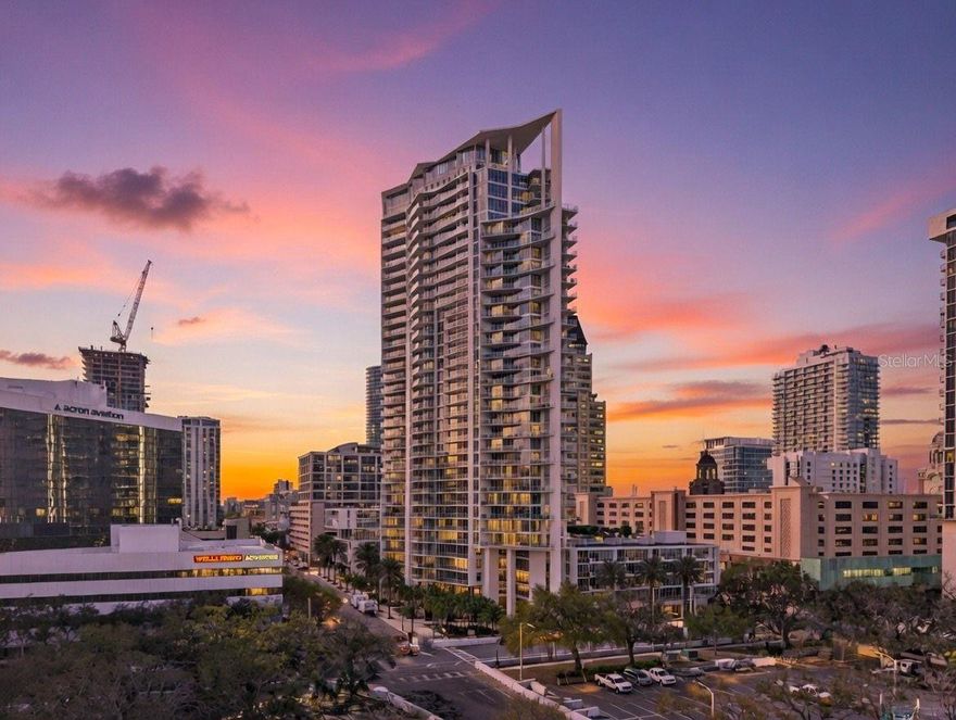 Welcome to Unit 3102, an ultra-rare junior penthouse—one of only three in the entire building—offering a level of exclusivity, scale, and refinement rarely found in downtown St. Petersburg. Defined by its remarkable five private balconies, this residence captures both breathtaking sunrises over Tampa Bay and golden sunsets across the city skyline, creating an ever-changing backdrop of light, water, and energy. With 3 bedrooms, a den, and an additional sitting room, the layout lives more like a private residence in the sky—thoughtfully designed to offer both grand entertaining spaces and intimate retreats. At the heart of the home, the chef’s kitchen is a statement of sophistication, outfitted with premium Thermador and Miele appliances, sleek finishes, and seamless flow into the living and dining areas—perfect for hosting elevated gatherings or enjoying a quiet evening that effortlessly extends onto one of your private terraces. The primary suite is a true sanctuary, offering a serene escape above the city, while the additional sitting room and den provide versatile, refined spaces to unwind, read, or simply take in the sweeping panoramic vistas in complete privacy. Every element of this residence has been curated to deliver a sense of comfort, elegance, and effortless luxury, with the scale and flow reminiscent of a single-family home. Life at Signature Place transcends the ordinary—offering a resort-inspired lifestyle with a Zen-like pool deck overlooking the water, state-of-the-art fitness center, and 24-hour concierge services designed to anticipate your every need. With secured parking, private storage, and immediate access to Beach Drive, world-class dining, marinas, museums, and vibrant city life, this is urban-coastal living at its absolute finest. One of three. Five balconies. A lifestyle reserved for the truly discerning.