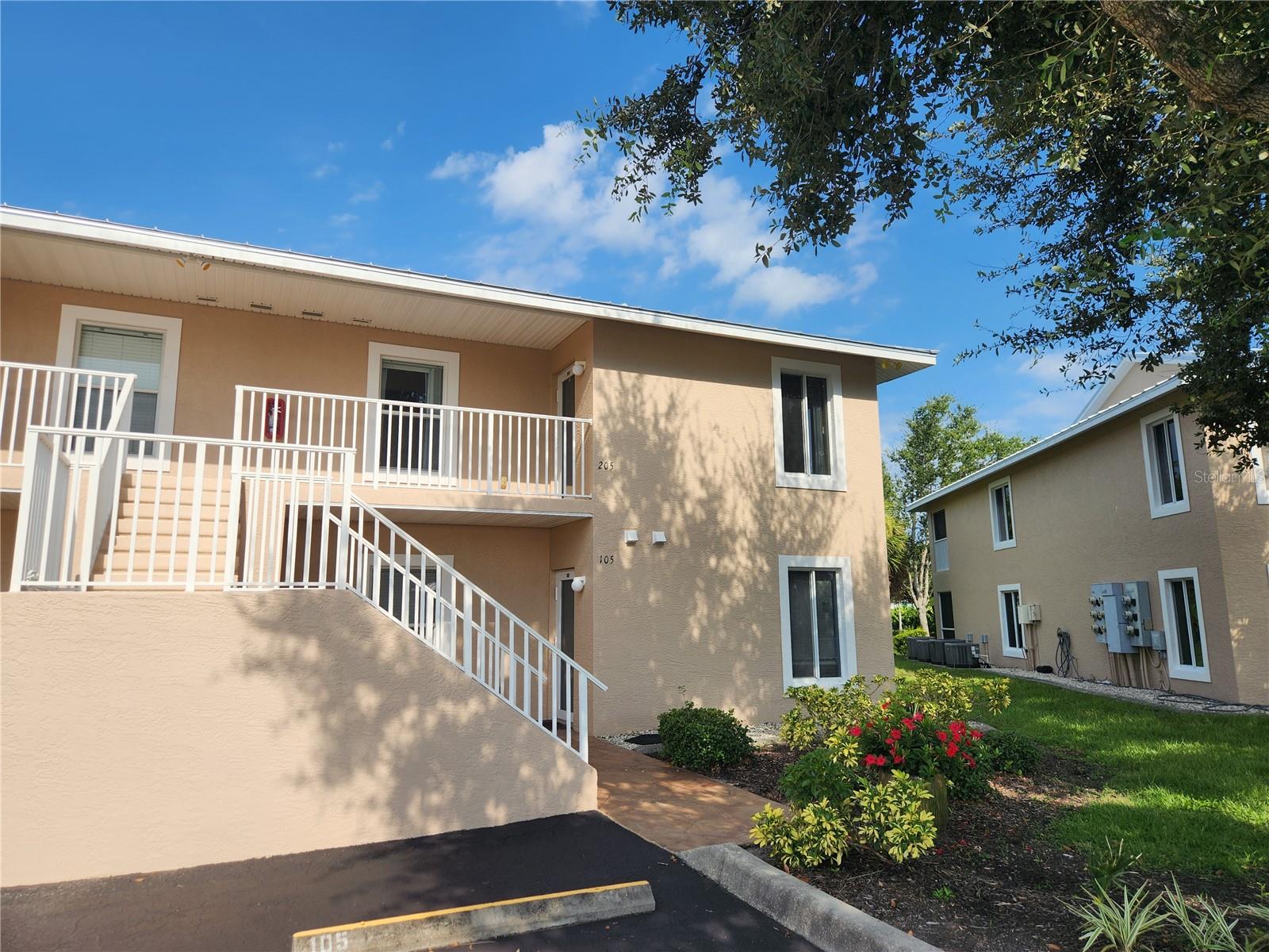 Fiddler’s Green Nature Trail – Bright & Airy Upstairs End Unit with Carport
Welcome to this charming 2-bedroom, 2-bath condo nestled in the desirable Fiddler’s Green Nature Trail community. This upstairs end unit offers added privacy and natural light, complete with its own carport to keep your vehicle cool and protected from the elements.
Enjoy a peaceful view of lush greenspace from your large screened lanai, surrounded by mature plants and trees. The open floorplan features vaulted ceilings and side windows, bringing in abundant natural light and creating a warm, inviting atmosphere.
The building exterior has been completely updated with a new metal roof, fresh paint, and new pavement—making it move-in ready for your personal touch.
Located directly across from the pool, clubhouse, and tennis courts, this unit offers convenience and easy access to community amenities. Plus, you're just minutes away from world-class golfing, beaches, and fishing—the best of Florida living!
