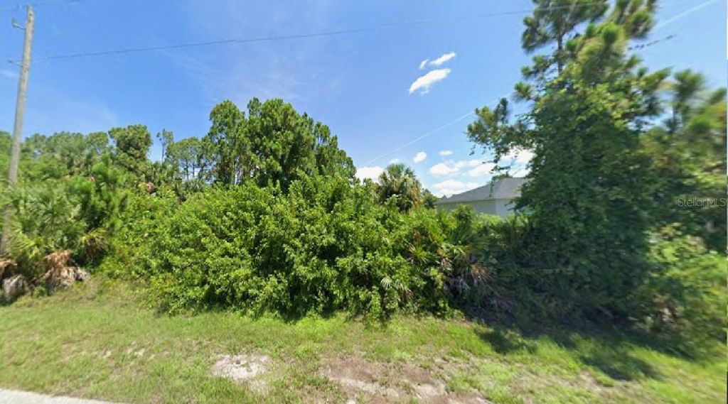Photo of 12244 Clarendon Avenue, Port Charlotte, FL 33981 (MLS # R4910262)
