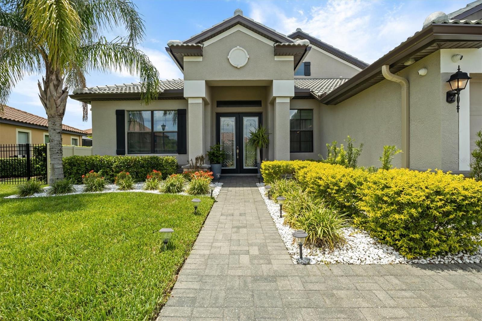 Welcome to your Mediterranean style dream home in sunny central Florida, which is in the sought after gated resort style community, Terra Largo. In this stunning 5-bedroom, 4-bathroom pool home nothing has been spared and offers the perfect blend of luxury, comfort, and privacy. Step inside to discover a beautifully updated kitchen featuring sleek quartz countertops, new backsplash, and all new and stainless steel appliances updated in (2021)— ideal for everyday living and entertaining and a walk-pantry perfect for any home chef. Throughout you'll find elegant new wood floors and upgraded baseboards all on the main floors and stairs, adding warmth and style. Enjoy the charm of custom wall features in the den/office and living room, adding character to the main living spaces. Have peace of mind with a new roof (2023), gutters (2024) new 3.5-ton A/C (2023), gutters, and freshly sealed pavers that add to the home's curb appeal and have a 1 year warranty good until 7/23/26. The large master bedroom is a true retreat, featuring his and hers walk-in custom closets (2022) with spa like en-suite bath. Upstairs, you'll find a spacious bonus area with its own private bath—ideal for a playroom, home gym, or second master suite. Relax and unwind in your private backyard oasis complete with a sparkling pool and jacuzzi, surrounded by custom landscaping (2024) that creates a tranquil escape. The 3-car garage for ample storage. As part of the exclusive Terra Largo neighborhood, you'll have access to amazing amenities, including a beautifully maintained clubhouse with a zero-depth entry pool, spa/hot-tub, state-of-the-art fitness center, tennis/basketball courts, gazebo, rental party room, covered playground, and lush landscaping. Located just minutes from shopping, dining, and I-4 access with just a short drive to Disney World and theme parks, and Tampa beaches. Whether you're looking for a family home, vacation getaway, or investment property, this gem offers the perfect combination of location, luxury, and lifestyle. VA loan is assumable! This home is truly move-in ready, with all major big-ticket items already taken care of. schedule your private showing today!