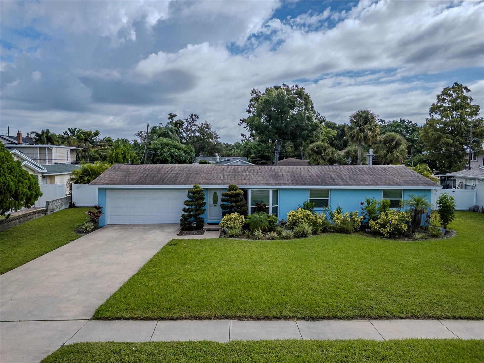 Huge, DOUBLE lot property (over 1/4 acre) in non flood zone, sought after Allendale/Magnolia Heights neighborhoods. Great for developer to build 2 homes or for primary/secondary home. This cement block residence has a gorgeous screened in patio for an additional 432 sq ft of living space and a large, in ground, heated swimming pool 13'X 26'. This home used to have 3 bedrooms and was opened up to have a larger living room space. Can easily convert back to 3 bedrooms. With 2 full bathrooms including a primary bedroom with ensuite bathroom, you have plenty of space for guests. Plus an oversized, 2-car garage(520 sq ft) for all your car and storage needs. Custom blinds on all windows. Custom closet system in primary bedroom. Front lawn sprinkler system with newer well makes keeping the grass green a breeze. Recycled water bin automatically waters front trees also. Amazing location where you can walk to the post office, a beautiful park, New ALDI a block away, numerous restaurants, bars and businesses just 3-4 blocks away. Close to 275 onramp for easy access to Tampa or Sarasota. 20 minutes to the beaches. One of the highest elevations in St Pete.