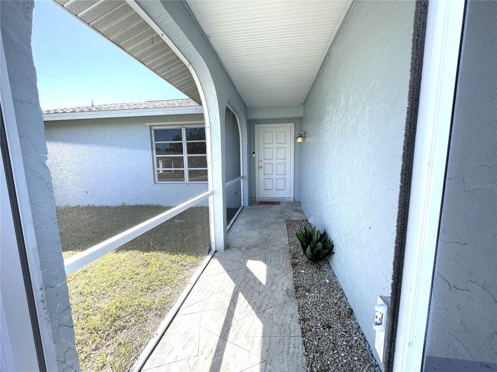 Photo of 234 Shadow Street NW, Port Charlotte, FL 33952 (MLS # C7518430)