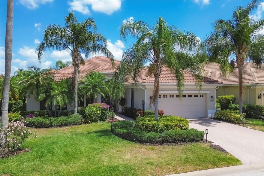 This beautifully appointed three-bedroom, two-bath plus office, maintenance-free Neal-built home offers serene water views and is ideally in the prestigious Lakewood Ranch Country Club, just one block from the main clubhouse. Designed for effortless Florida living, the home blends refined upgrades with a prime golf course community lifestyle. A newly painted exterior, manicured landscaping and a paver walkway welcome you to this beautiful home. Inside, the residence showcases thoughtful enhancements throughout, including new designer light fixtures, tile, and luxury vinyl flooring that add warmth and timeless appeal. Architectural arches, double glass doors, and pocketing sliding glass doors enhance the open, airy design while creating a seamless transition between indoor and outdoor living spaces. The spacious great room features high ceilings with tray detailing, abundant natural light and pocketing sliders that open to the lanai, making it ideal for entertaining and everyday living. Just off the great room, a private home office with French doors provides a quiet and functional workspace. At the heart of the home, the chef’s kitchen is stylish and functional, featuring abundant wood cabinetry, newly updated appliances, and generous counter space designed for cooking and entertaining. A charming eat-in breakfast nook offers a spot for casual dining while enjoying views of the outdoor living area, making this kitchen a welcoming hub for daily living and gatherings alike. The primary suite serves as a peaceful retreat, complete with French doors leading to the lanai and an en-suite bath featuring double vanities, a garden tub and a large walk-in shower. Two additional bedrooms and a guest bath offer comfortable accommodations for family and visitors. Go outside to the expansive covered lanai, ideal for outdoor dining or relaxing while enjoying tranquil water views. The saltwater heated pool overlooks the picturesque pond, creating a private backyard oasis. Recent upgrades include washer and dryer, recently installed HVAC and water heater, and a re-screened lanai. Residents of Lakewood Ranch Country Club enjoy access to exceptional amenities including championship golf, tennis, pickleball, a fitness and wellness center, resort-style pools, and multiple dining and social options. Ideally in one of America’s top-selling planned communities with A-rated schools, this home is just minutes from UTC shopping and dining, SRQ Airport, and a short drive to downtown Sarasota and world-class Gulf beaches.